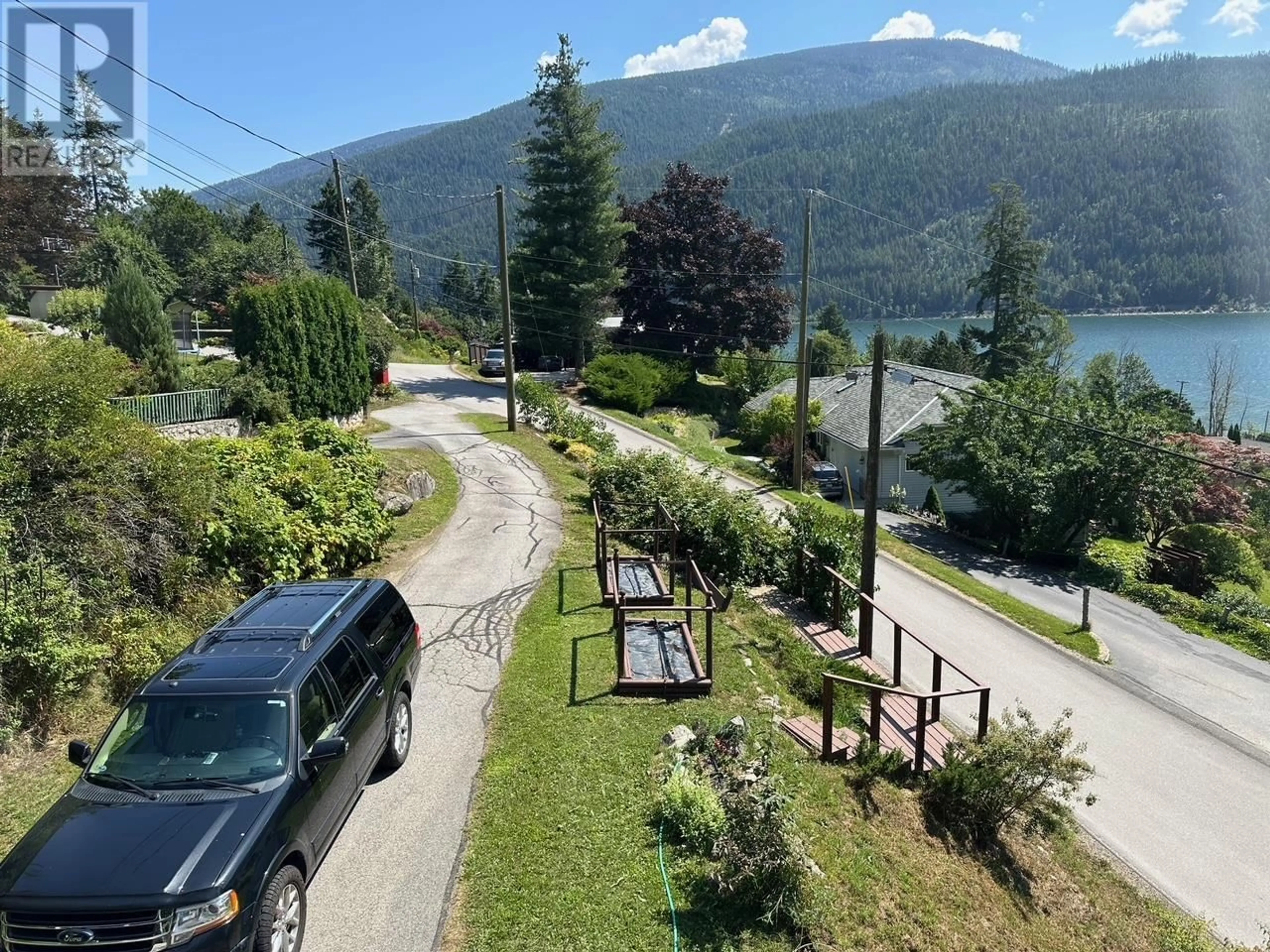 A pic from outside/outdoor area/front of a property/back of a property/a pic from drone, mountain view for 1551 NASOOKIN ROAD, Nelson British Columbia V1L6J6