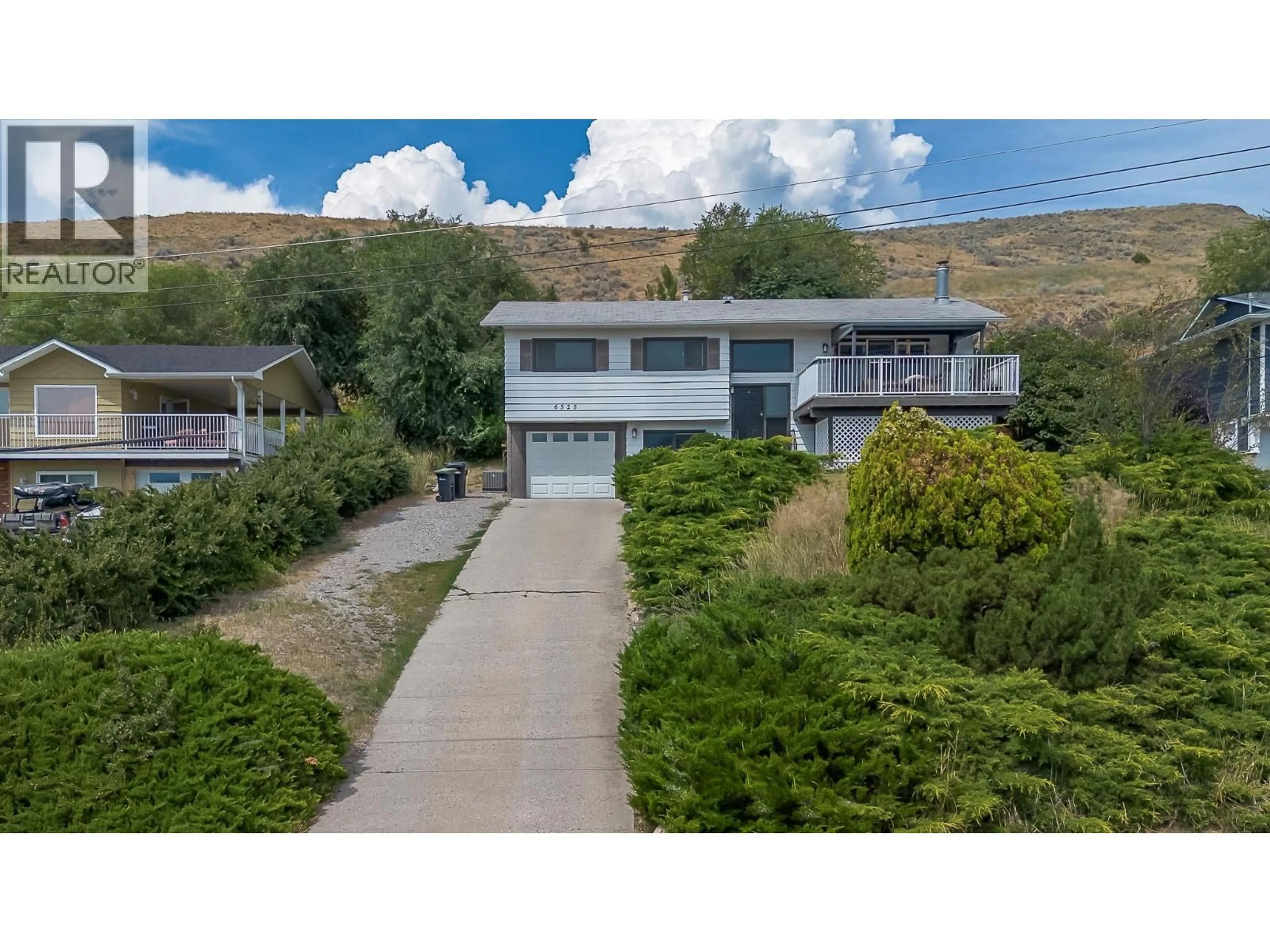A pic from outside/outdoor area/front of a property/back of a property/a pic from drone, unknown for 6525 SOUTHWIND ROAD, Vernon British Columbia V1H1B7