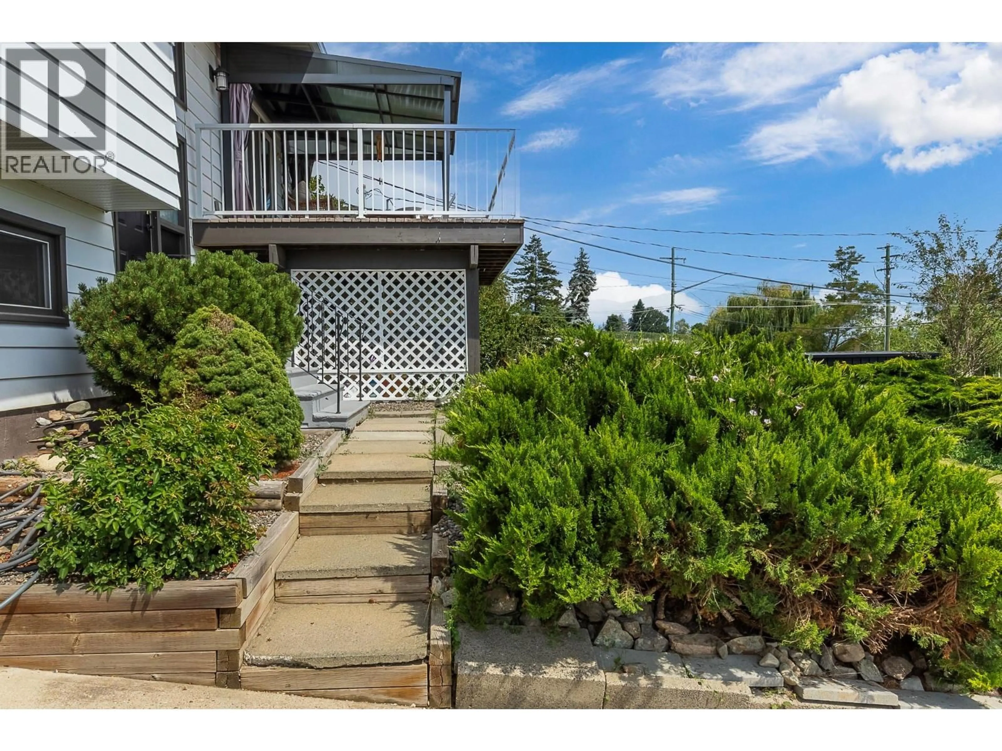 A pic from outside/outdoor area/front of a property/back of a property/a pic from drone, unknown for 6525 SOUTHWIND ROAD, Vernon British Columbia V1H1B7