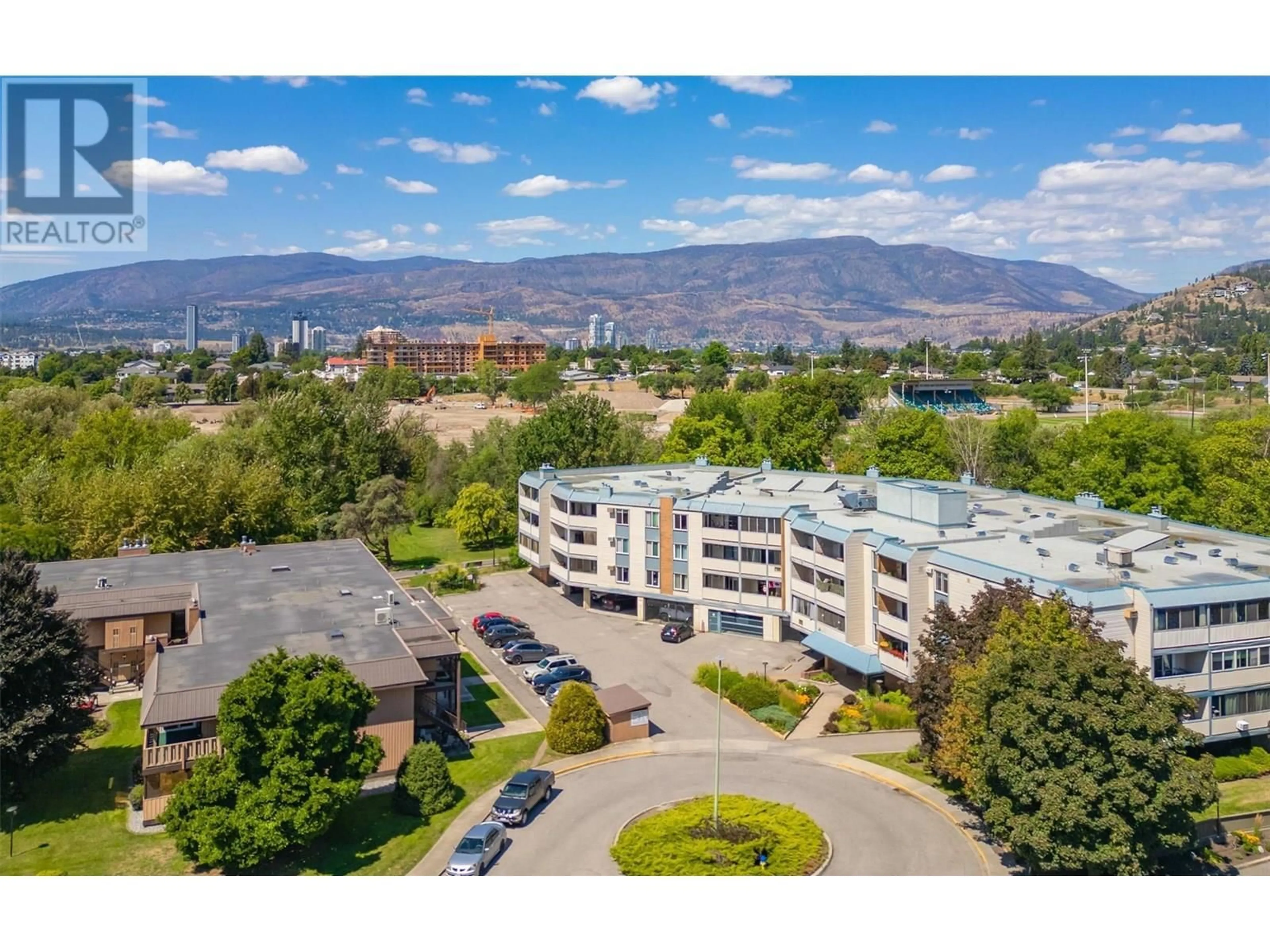 A pic from outside/outdoor area/front of a property/back of a property/a pic from drone, mountain view for 104 - 1640 UFTON COURT, Kelowna British Columbia V1Y8L5