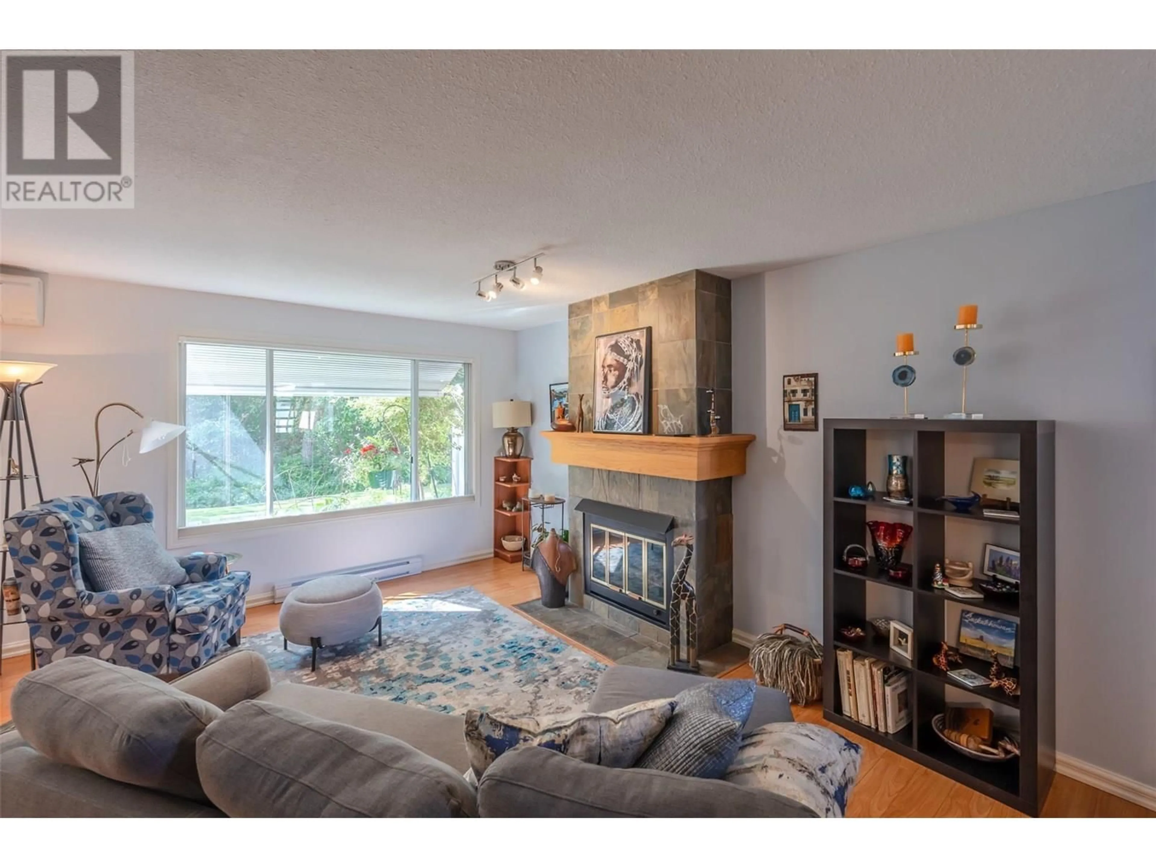 Living room with furniture, wood/laminate floor for 109 - 320 BRANDON AVENUE, Penticton British Columbia V2A3S8