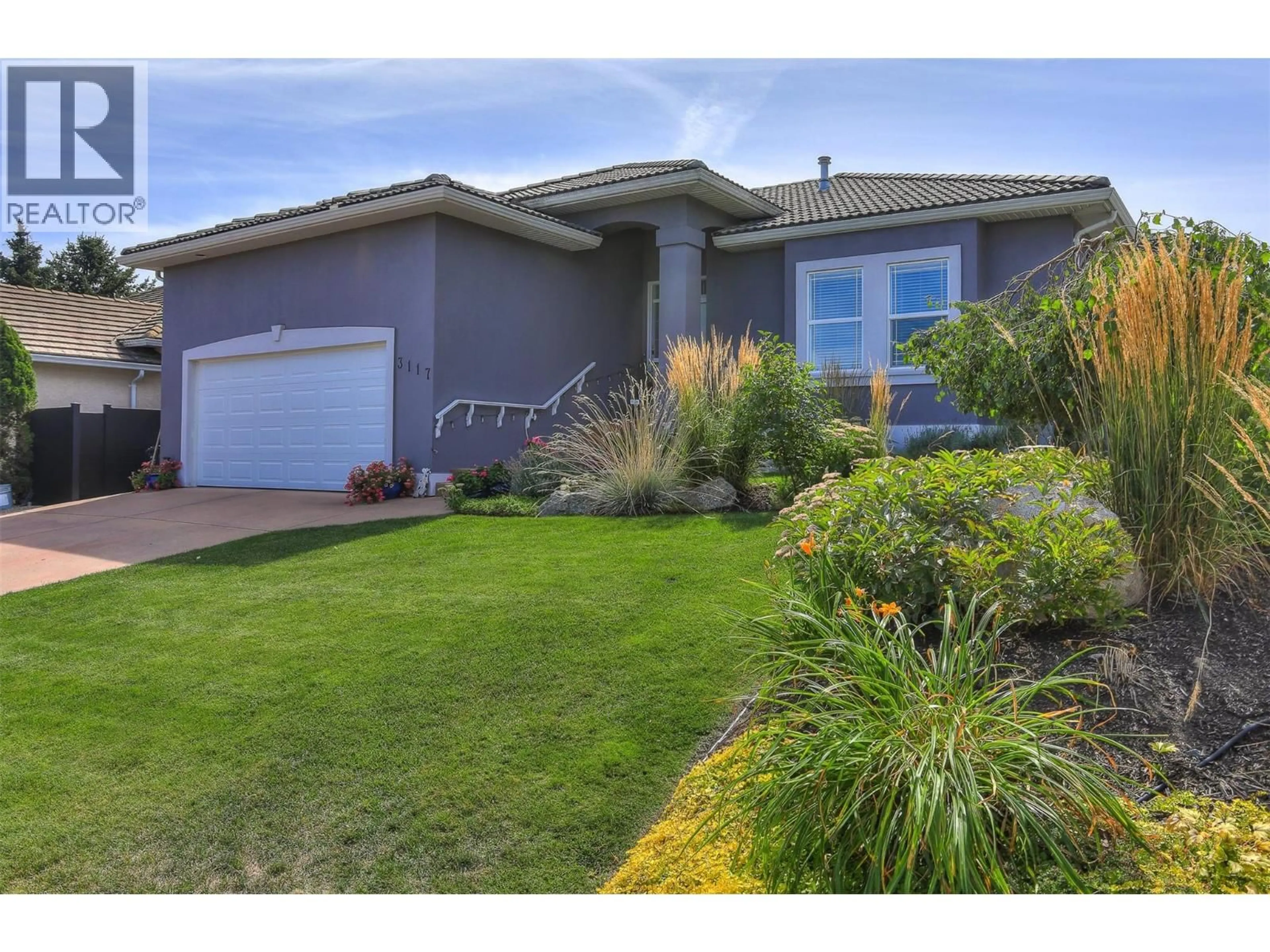 Home with vinyl exterior material, street for 3117 CAPISTRANO COURT, Kelowna British Columbia V1V2A2