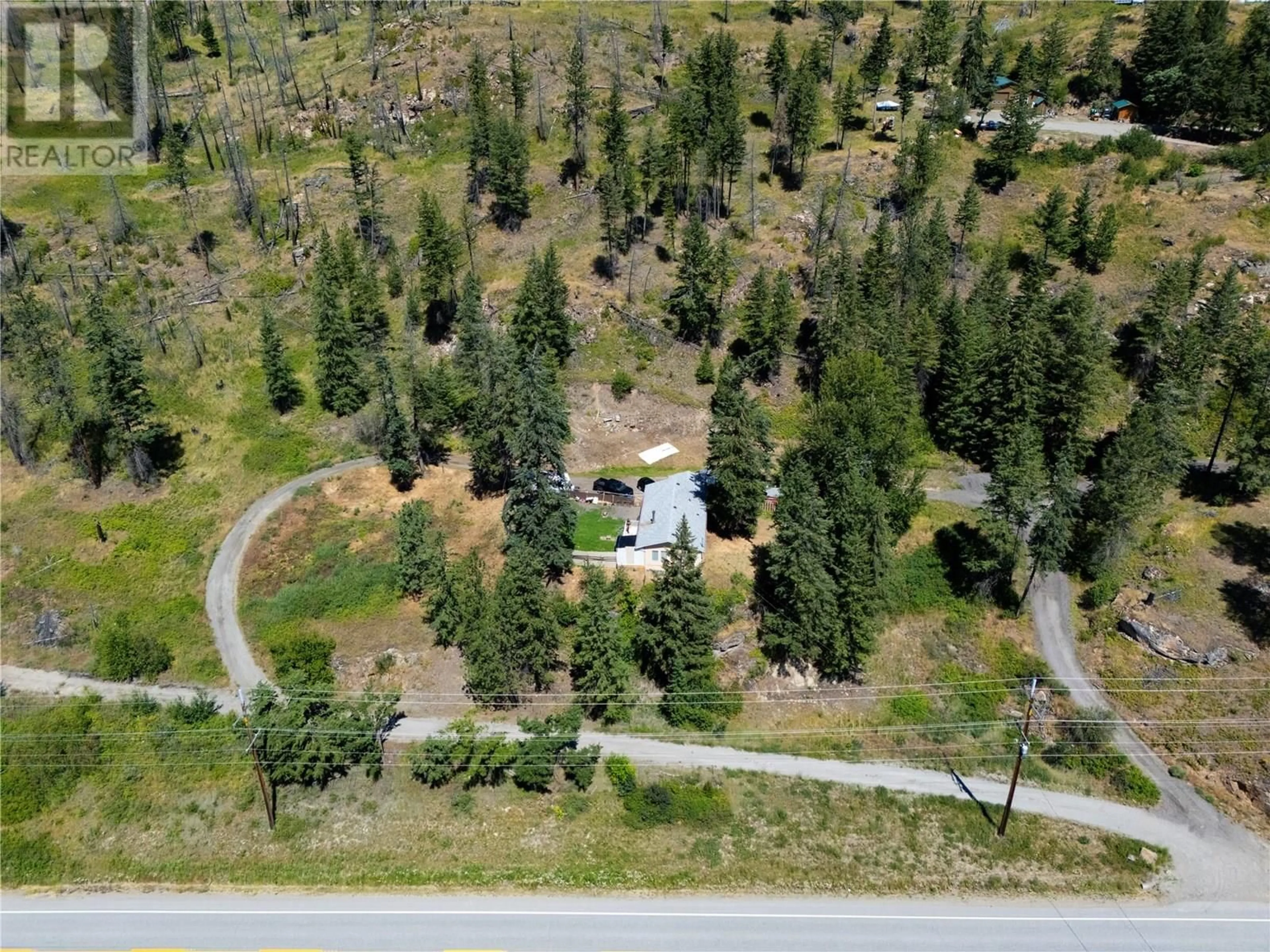 A pic from outside/outdoor area/front of a property/back of a property/a pic from drone, forest/trees view for 6090 HIGHWAY 33 OTHER, Kelowna British Columbia V1P1H8