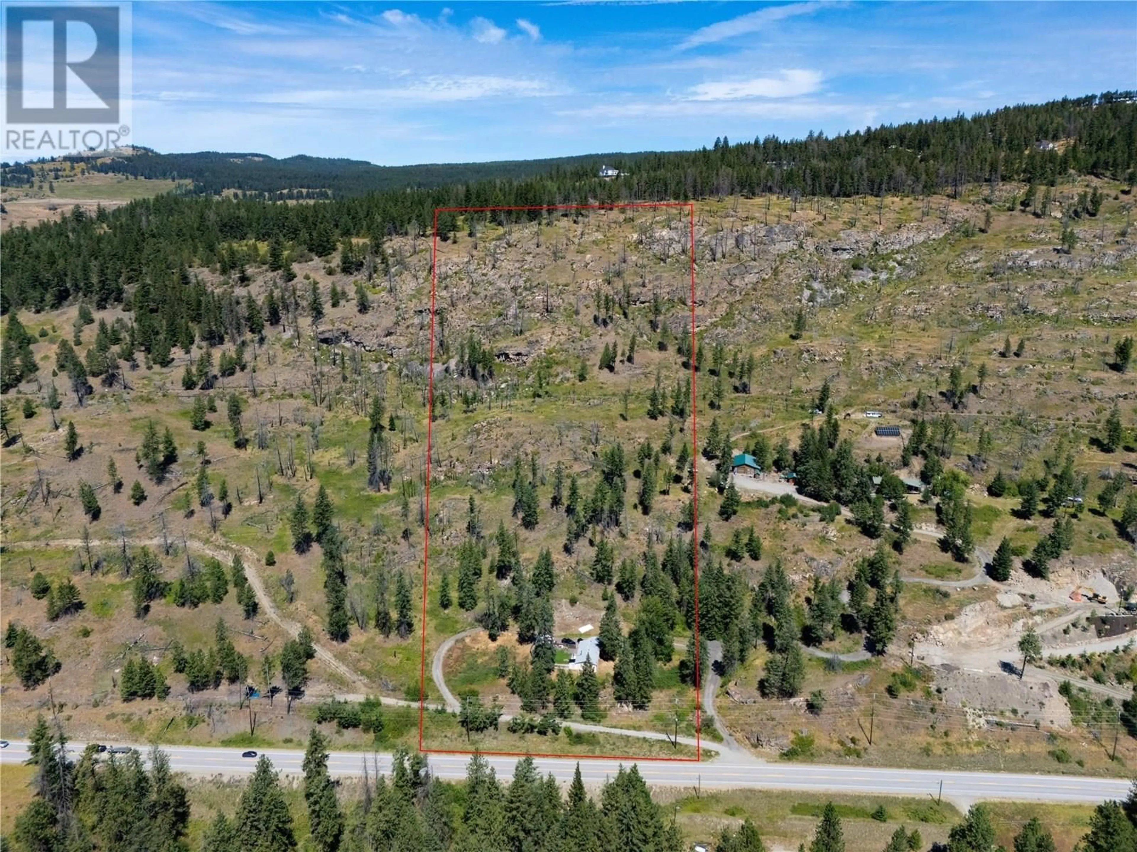 A pic from outside/outdoor area/front of a property/back of a property/a pic from drone, forest/trees view for 6090 HIGHWAY 33 OTHER, Kelowna British Columbia V1P1H8
