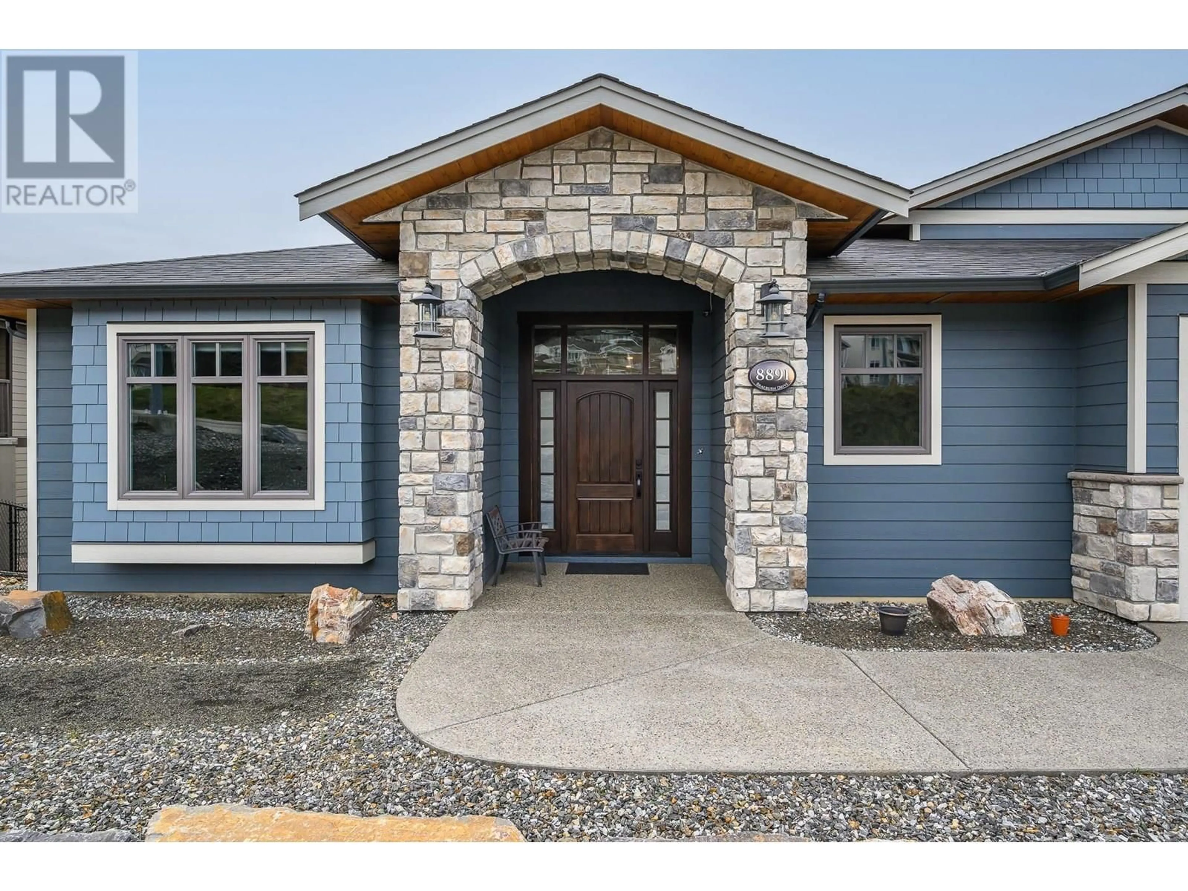 Home with brick exterior material, street for 8891 BRAEBURN DRIVE, Coldstream British Columbia V1B3W8