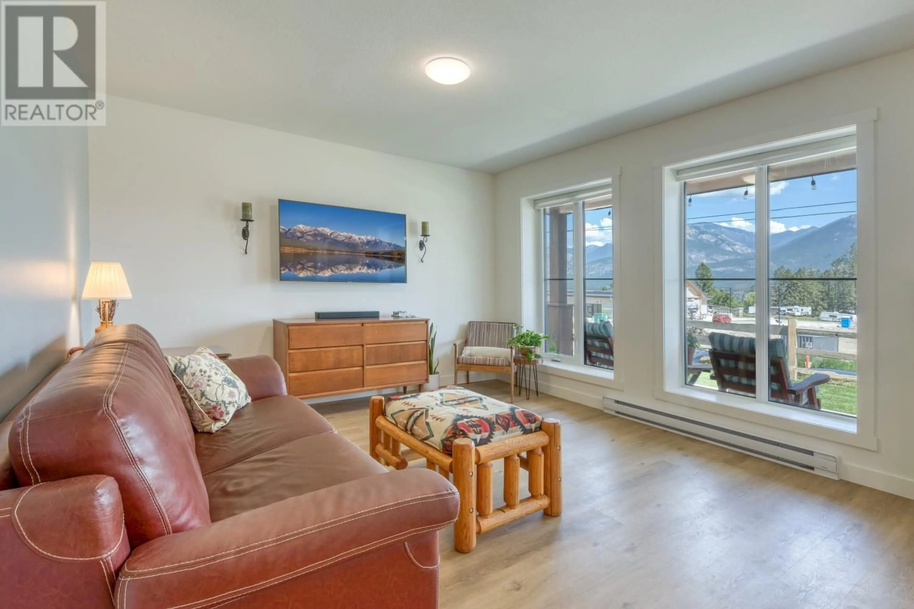 Living room with furniture, wood/laminate floor for 24 - 2101 PINE TREE WAY, Invermere British Columbia V0A1K4