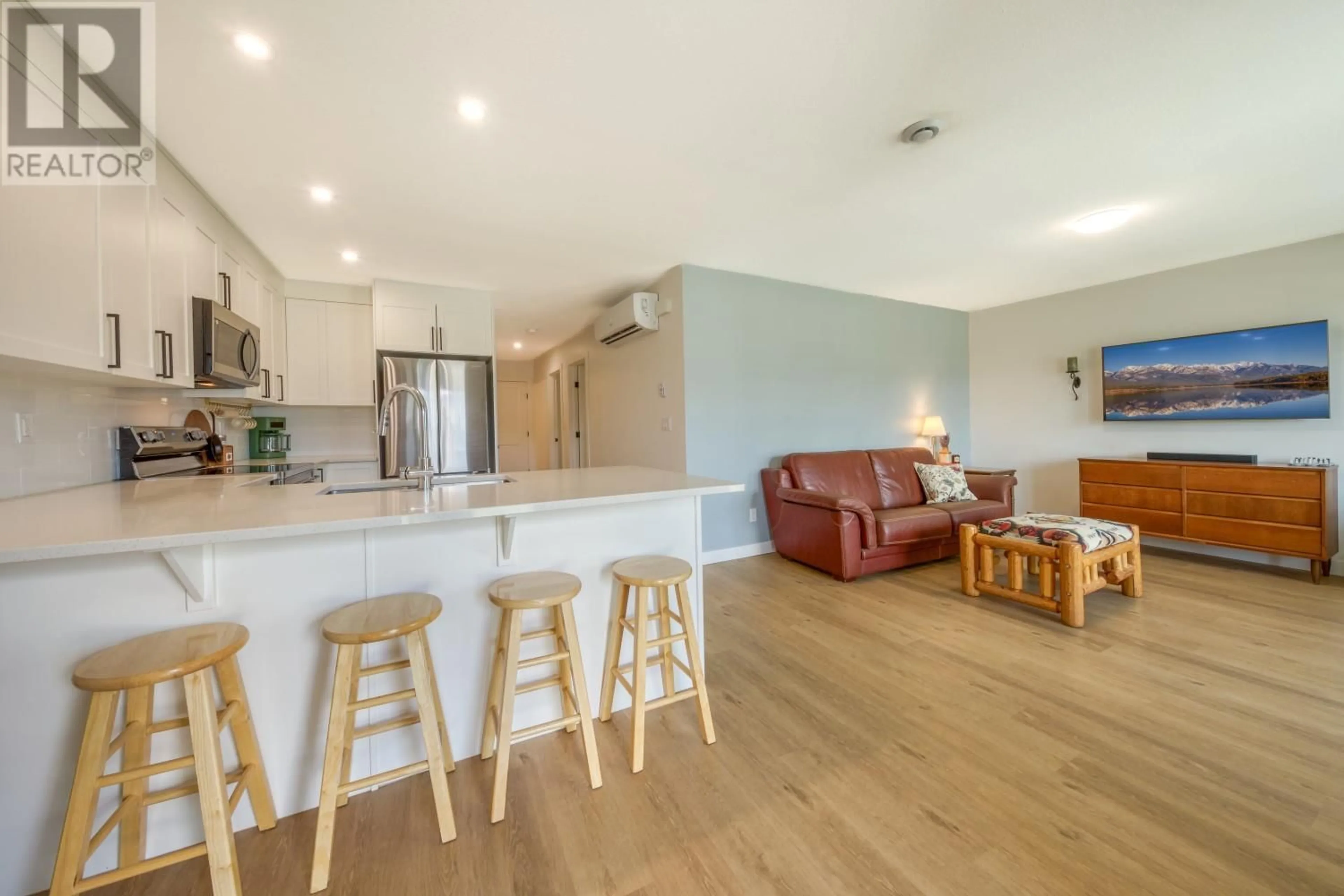 Open concept kitchen, wood/laminate floor for 24 - 2101 PINE TREE WAY, Invermere British Columbia V0A1K4