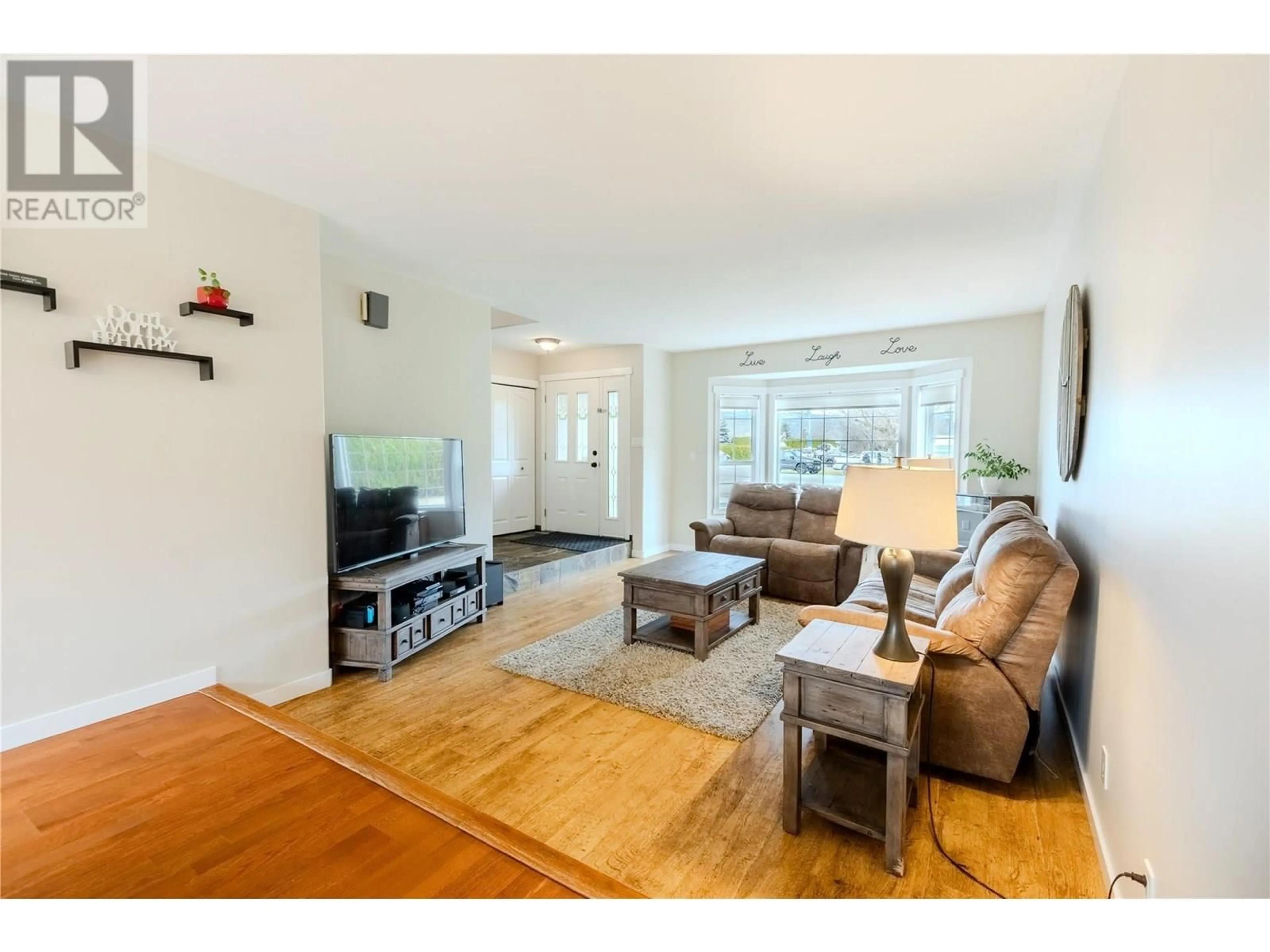 Living room with furniture, wood/laminate floor for 309 ARMOUR PLACE, Kamloops British Columbia V2H1L2
