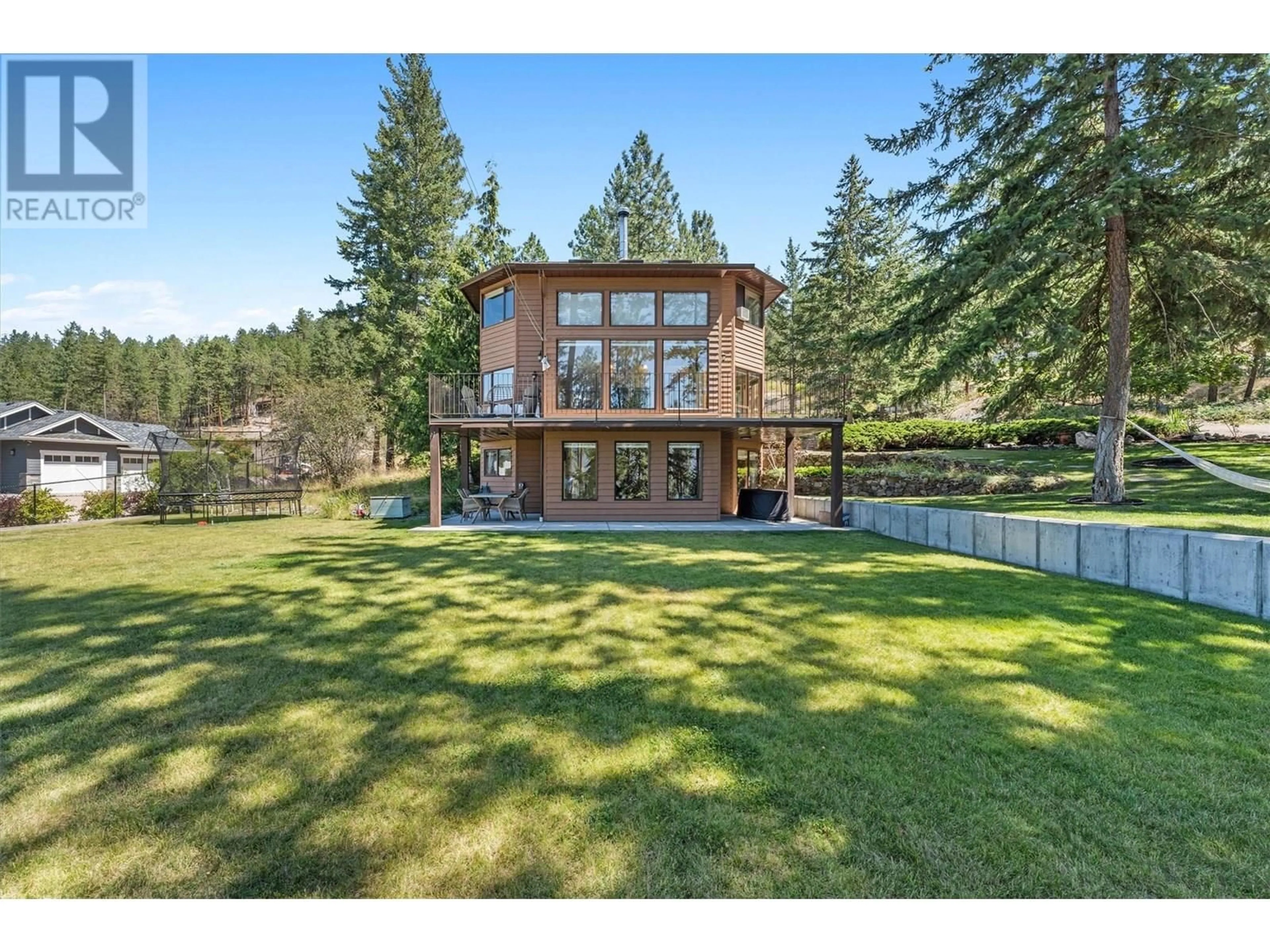 A pic from outside/outdoor area/front of a property/back of a property/a pic from drone, water/lake/river/ocean view for 4555 OTTLEY ROAD, Lake Country British Columbia V4K1N1