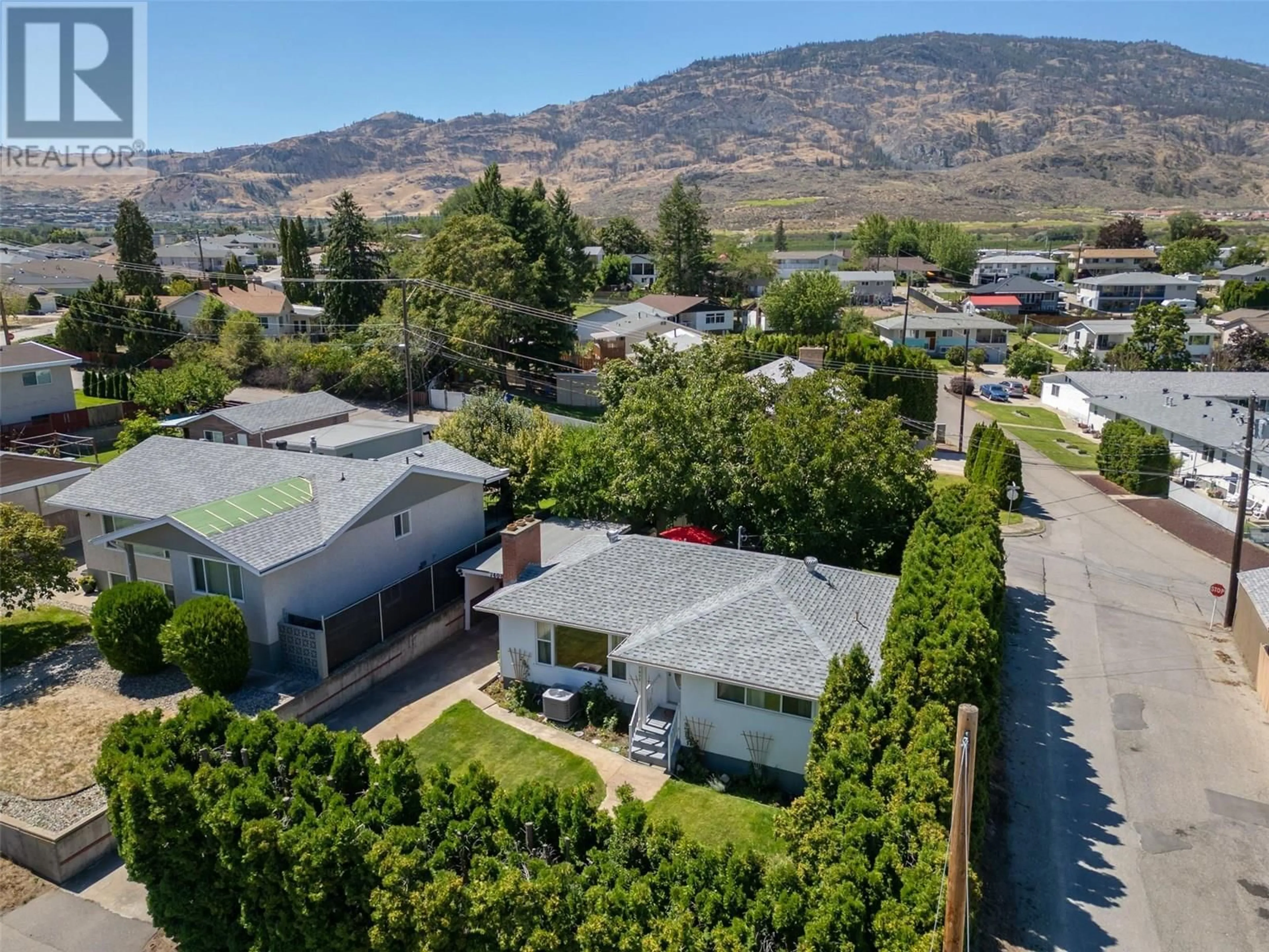 A pic from outside/outdoor area/front of a property/back of a property/a pic from drone, mountain view for 7408 HERON LANE, Osoyoos British Columbia V0H1V5