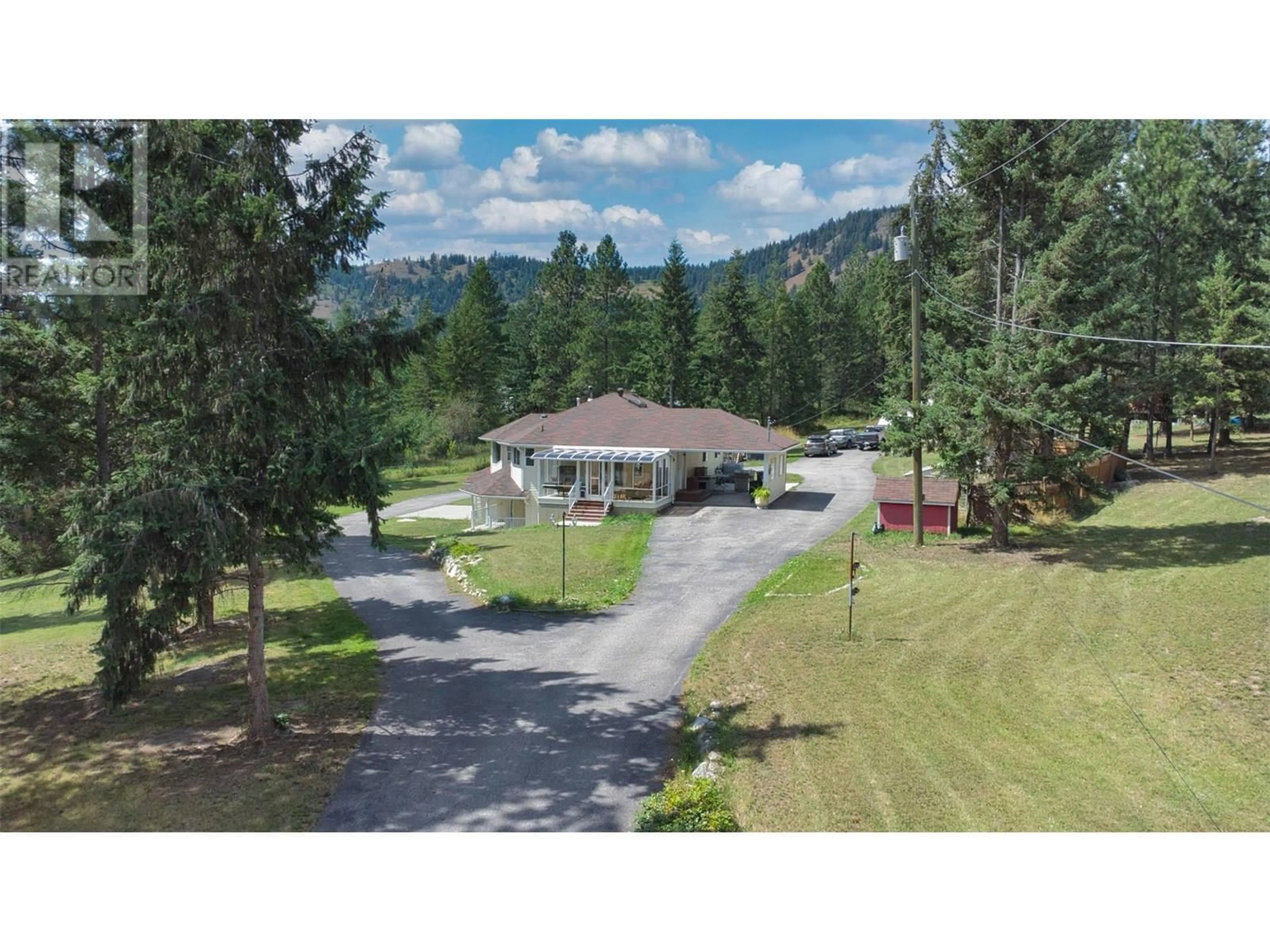 A pic from outside/outdoor area/front of a property/back of a property/a pic from drone, mountain view for 90 MCINNES ROAD, Lumby British Columbia V0E2G1