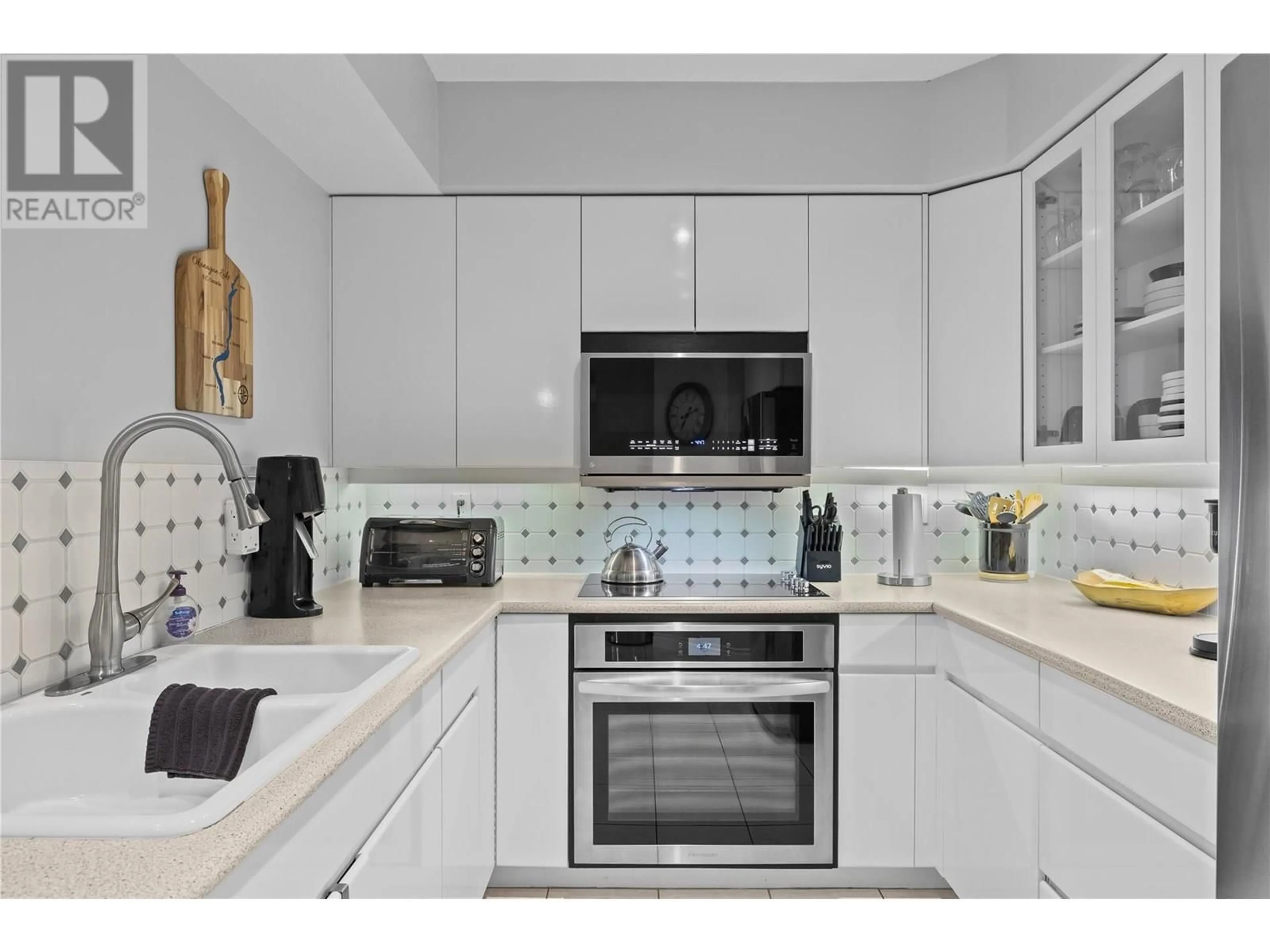 Contemporary kitchen, ceramic/tile floor for 706 - 1152 SUNSET DRIVE, Kelowna British Columbia V1Y9R7