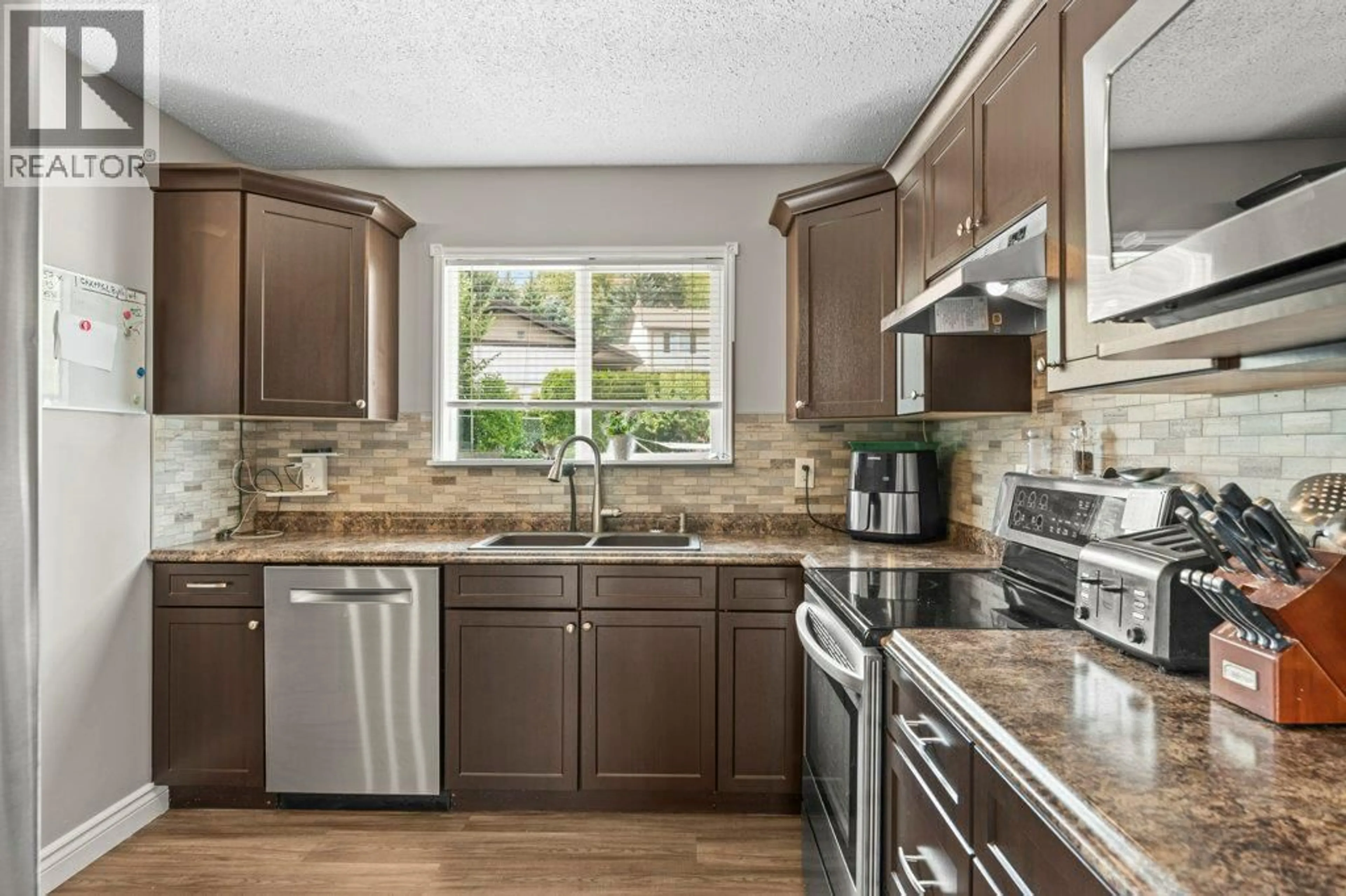 Open concept kitchen, ceramic/tile floor for 6390 CARDINAL ROAD, Vernon British Columbia V1H1W3