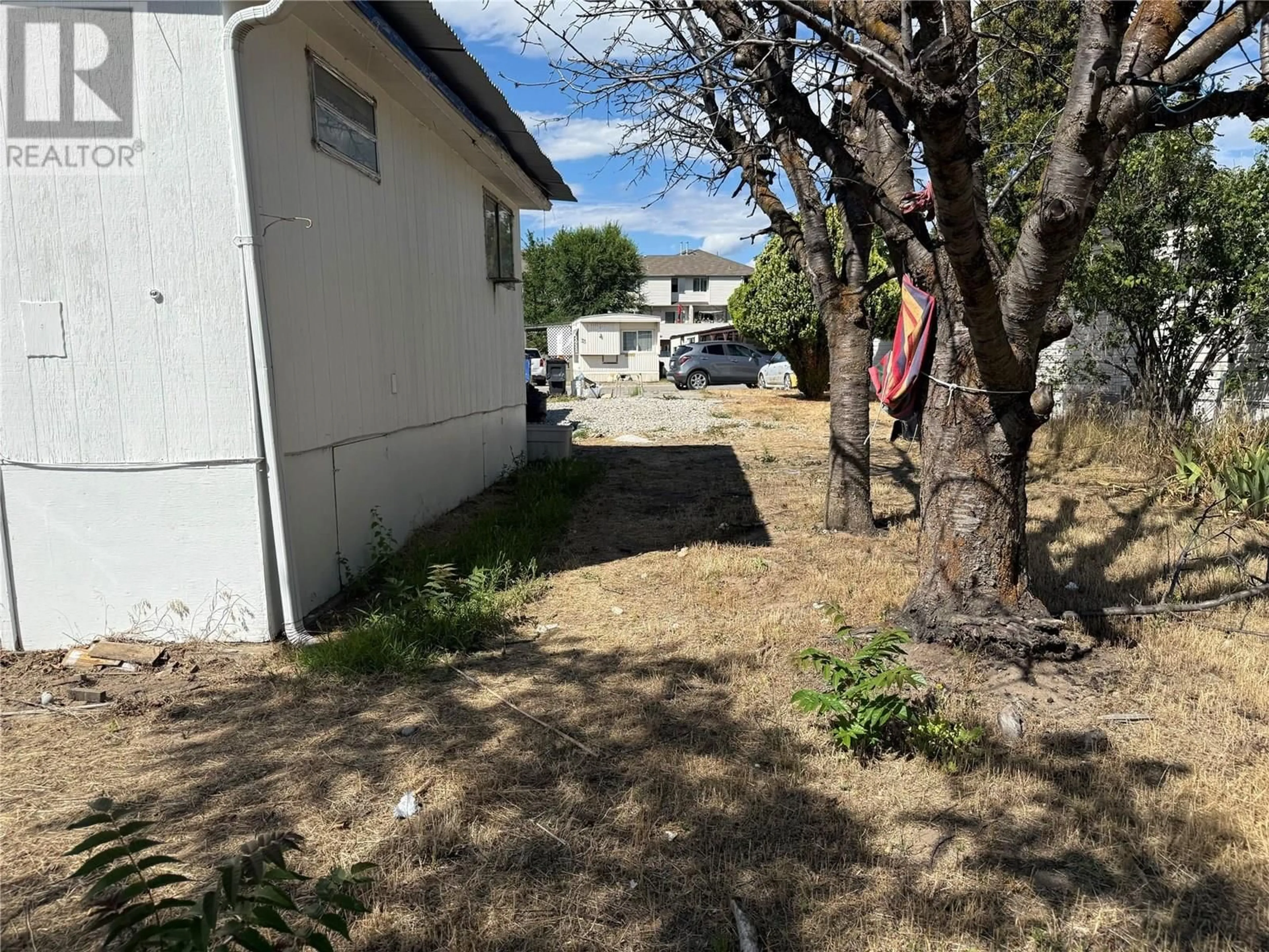 A pic from outside/outdoor area/front of a property/back of a property/a pic from drone, street for 36 - 3245 PARIS STREET, Penticton British Columbia V2A3T9