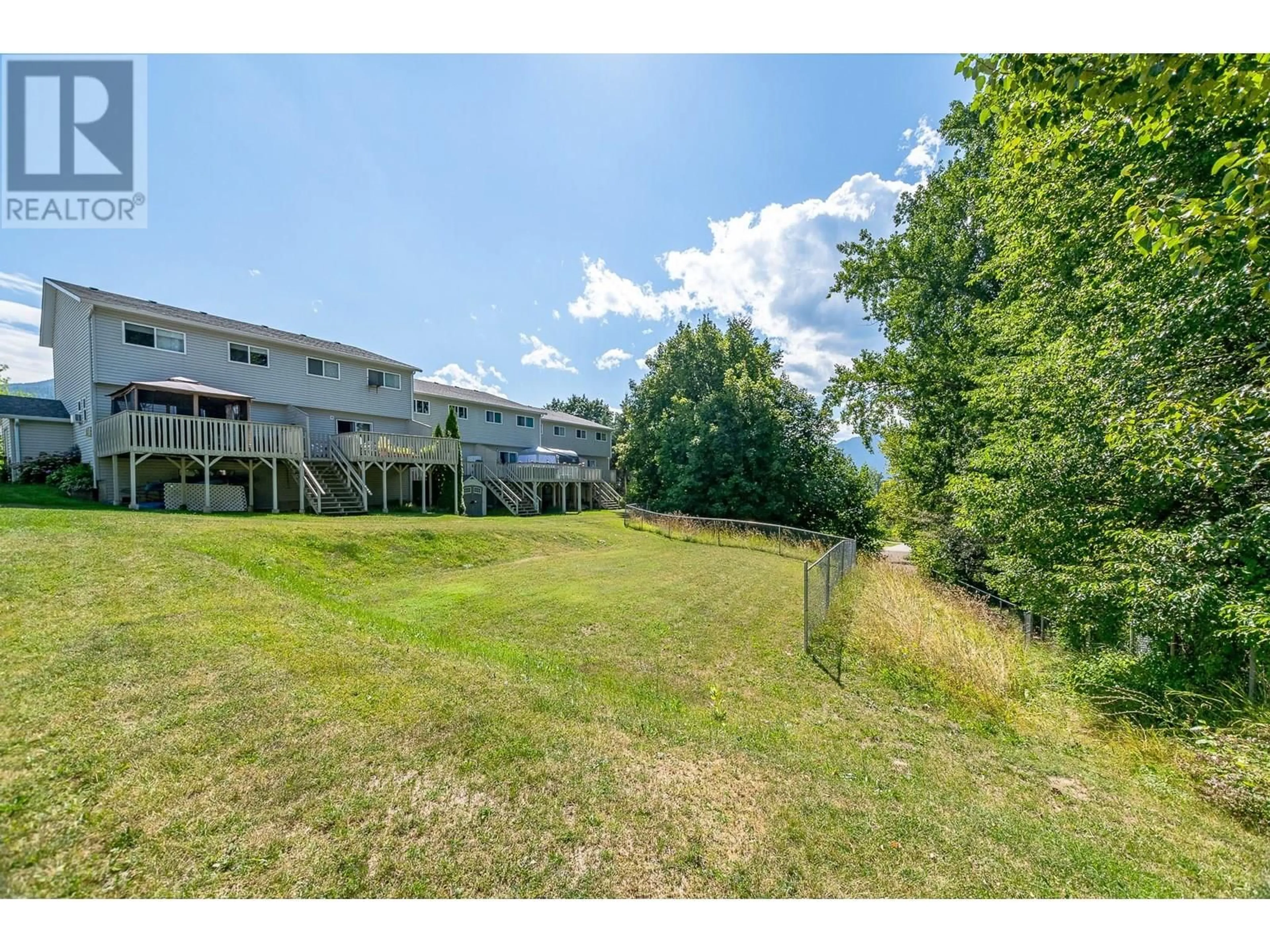 A pic from outside/outdoor area/front of a property/back of a property/a pic from drone, water/lake/river/ocean view for 563 24 STREET NORTHEAST, Salmon Arm British Columbia V1E2K2