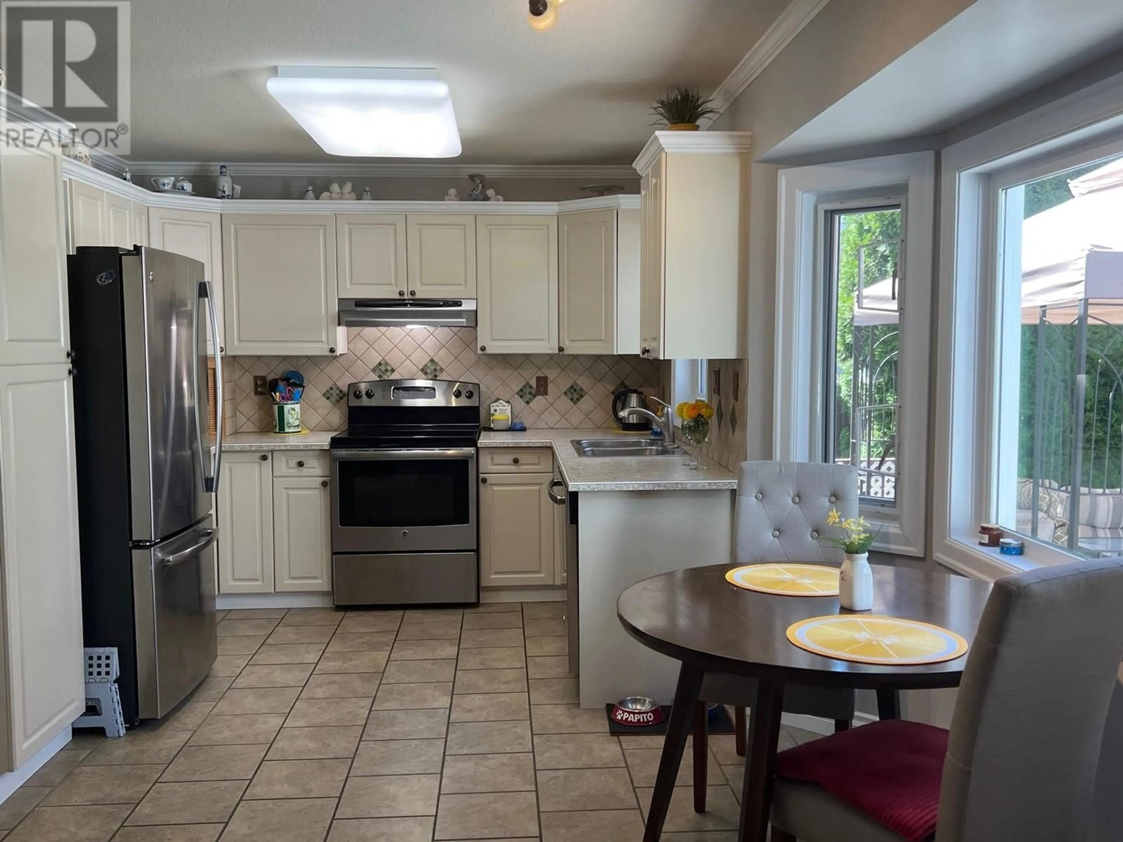 Open concept kitchen, ceramic/tile floor for 314 3 RD STREET, Vernon British Columbia V1H1Z1