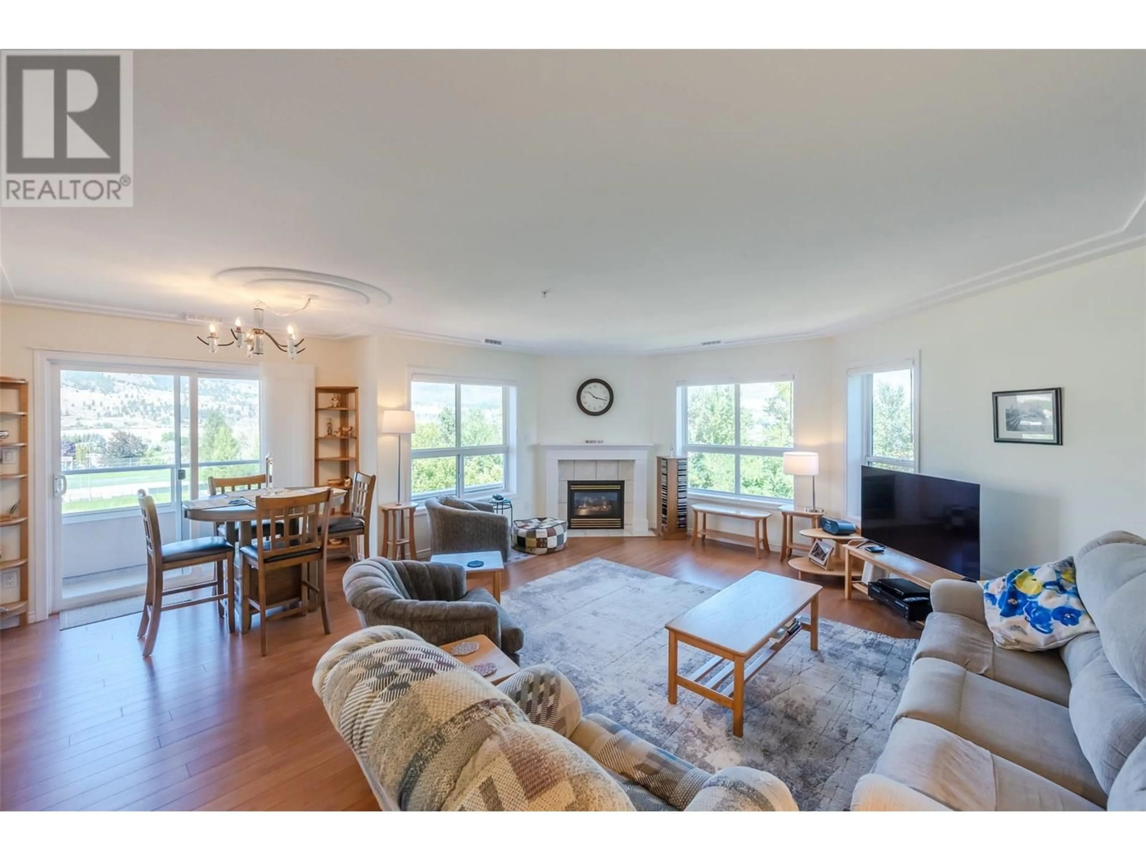 Living room with furniture, wood/laminate floor for 507 - 2255 ATKINSON STREET, Penticton British Columbia V2A8R7