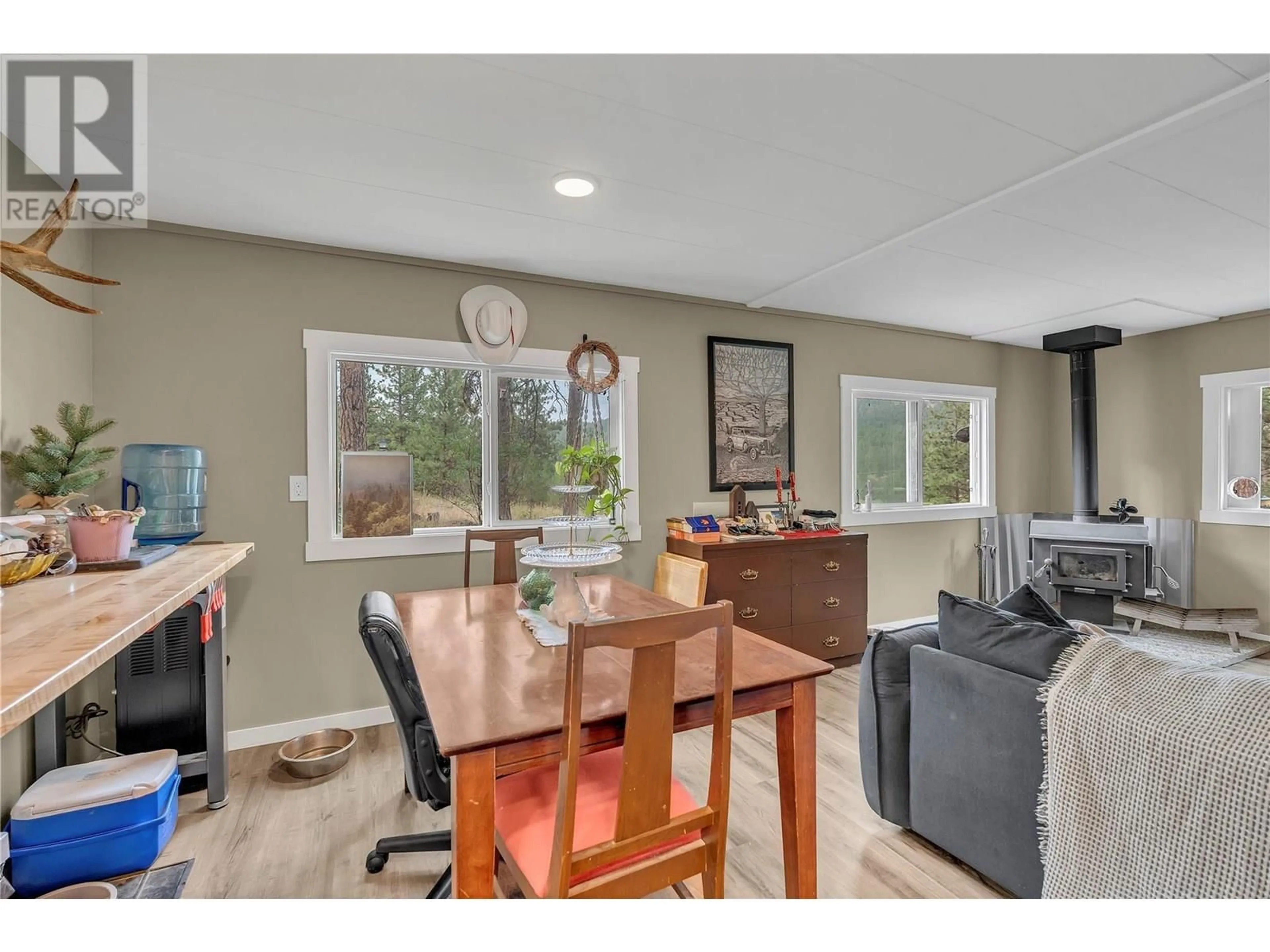Open concept kitchen, wood/laminate floor for 501 FISH LAKE ROAD, Summerland British Columbia V0H1Z8