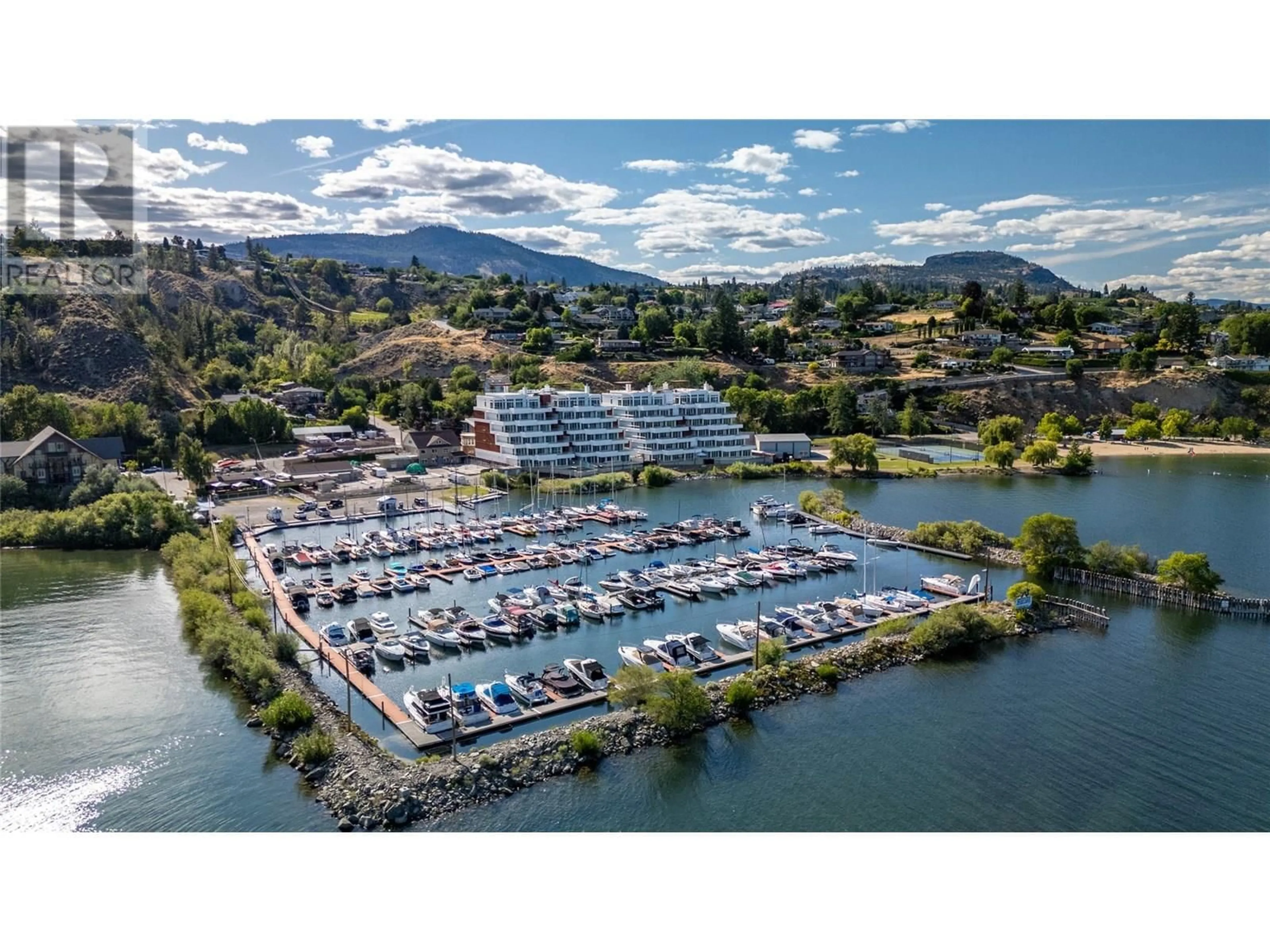 A pic from outside/outdoor area/front of a property/back of a property/a pic from drone, water/lake/river/ocean view for 202 - 13415 LAKESHORE DRIVE SOUTH, Summerland British Columbia V0H1Z1