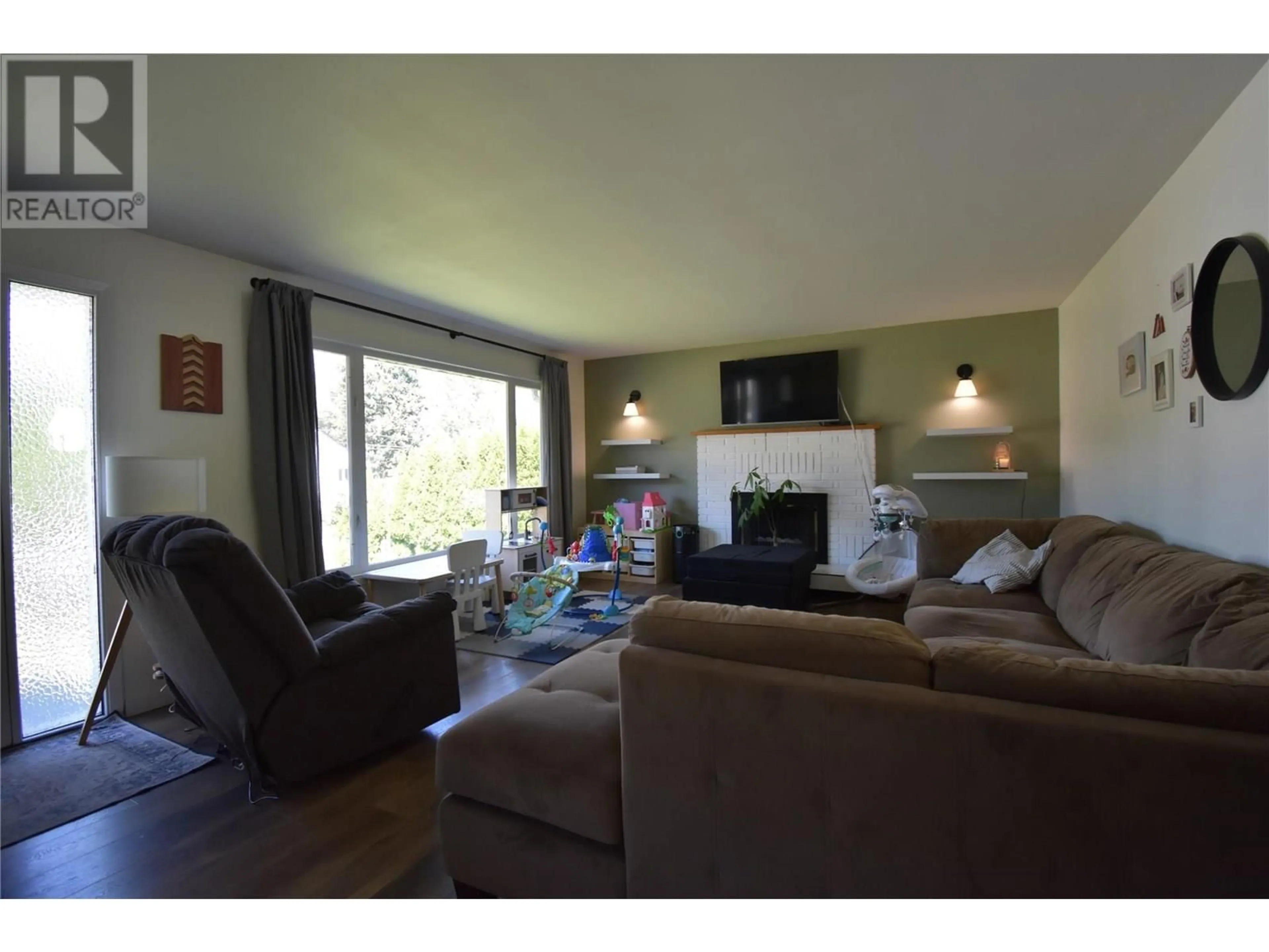 Living room with furniture, wood/laminate floor for 710 28TH STREET, Castlegar British Columbia V1N2P4