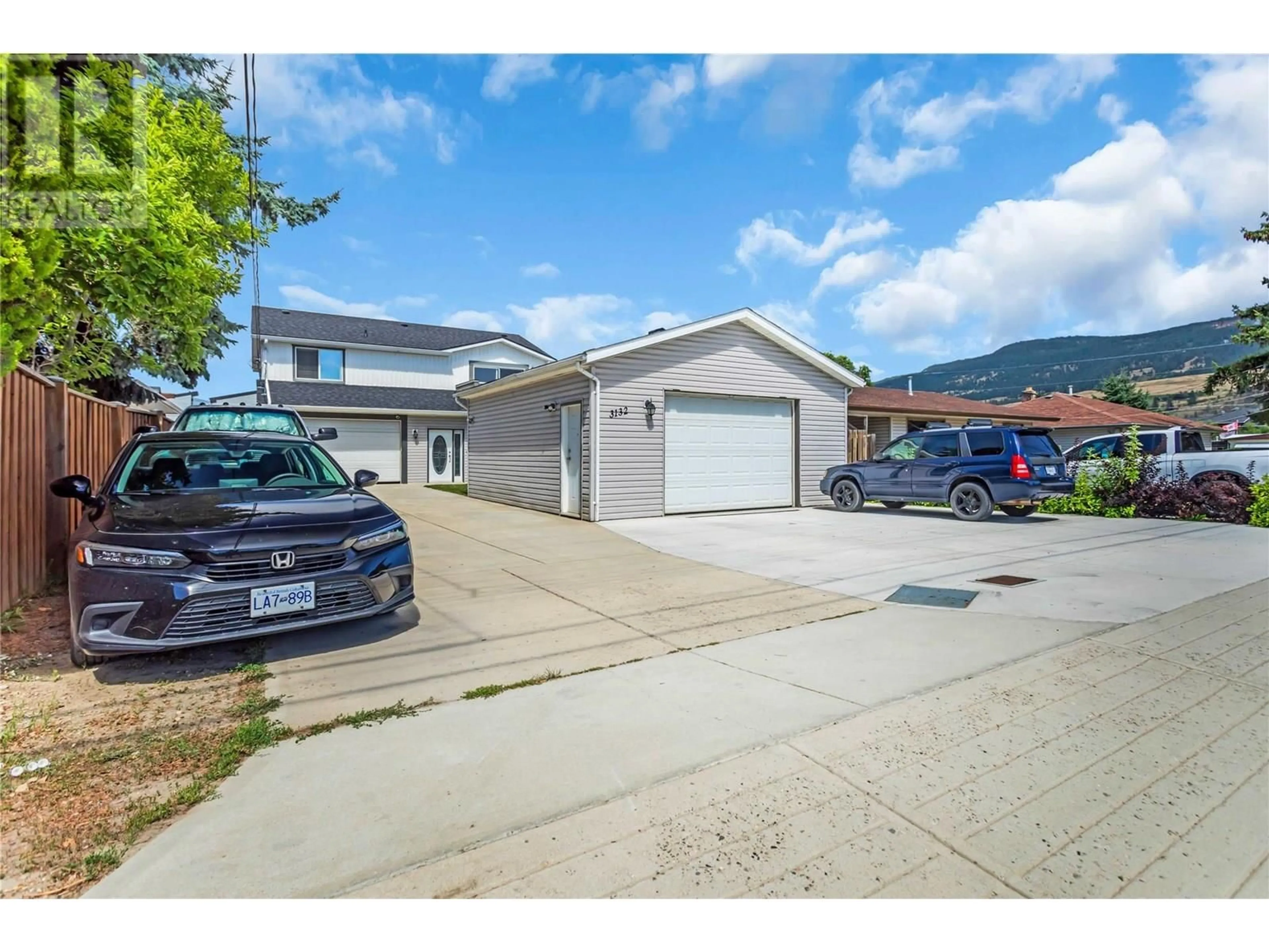 A pic from outside/outdoor area/front of a property/back of a property/a pic from drone, street for 3132 WOODSDALE ROAD, Lake Country British Columbia V4V1X8