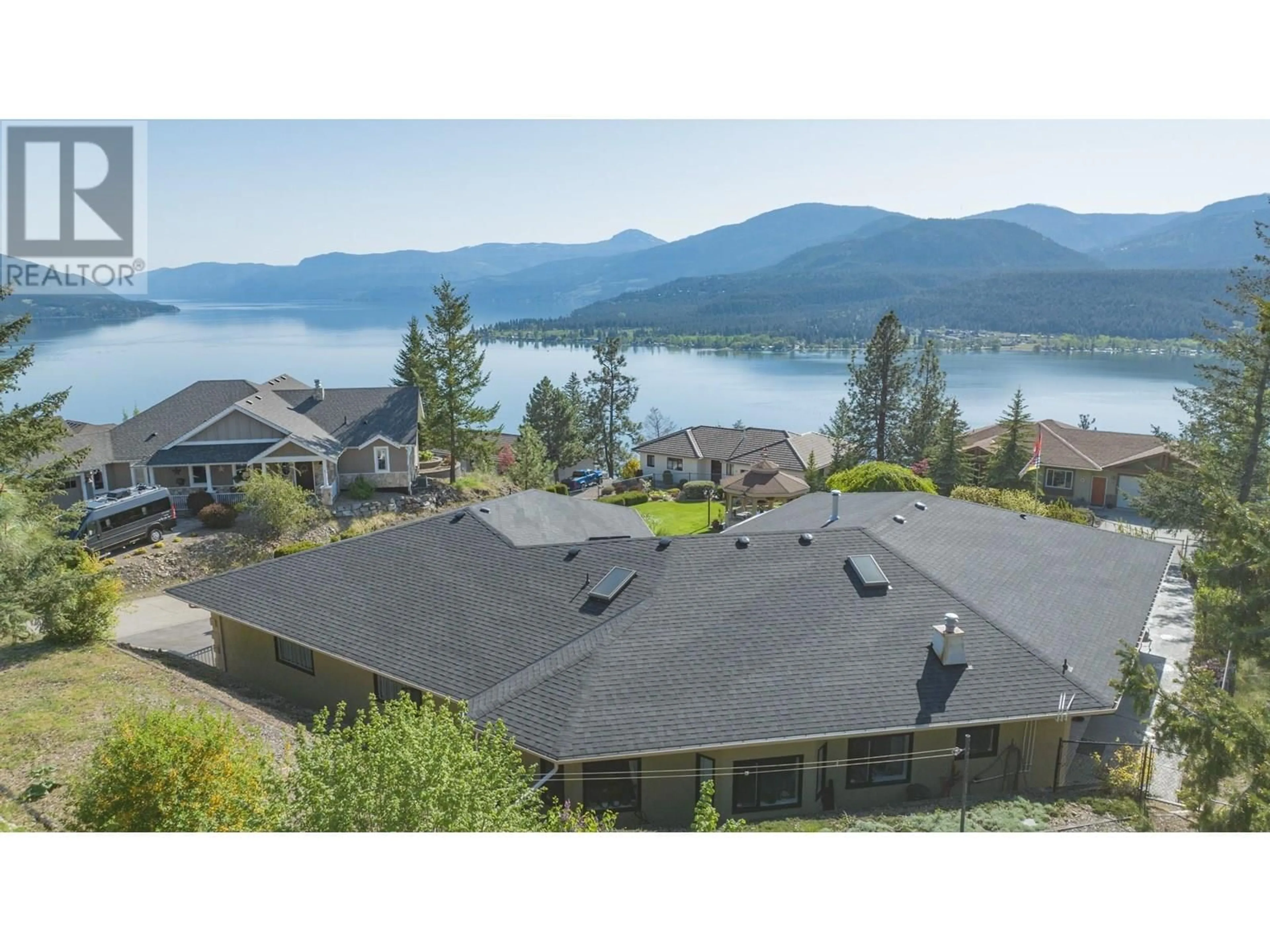 A pic from outside/outdoor area/front of a property/back of a property/a pic from drone, water/lake/river/ocean view for 6 9196 TRONSON ROAD, Vernon British Columbia V1H1E8