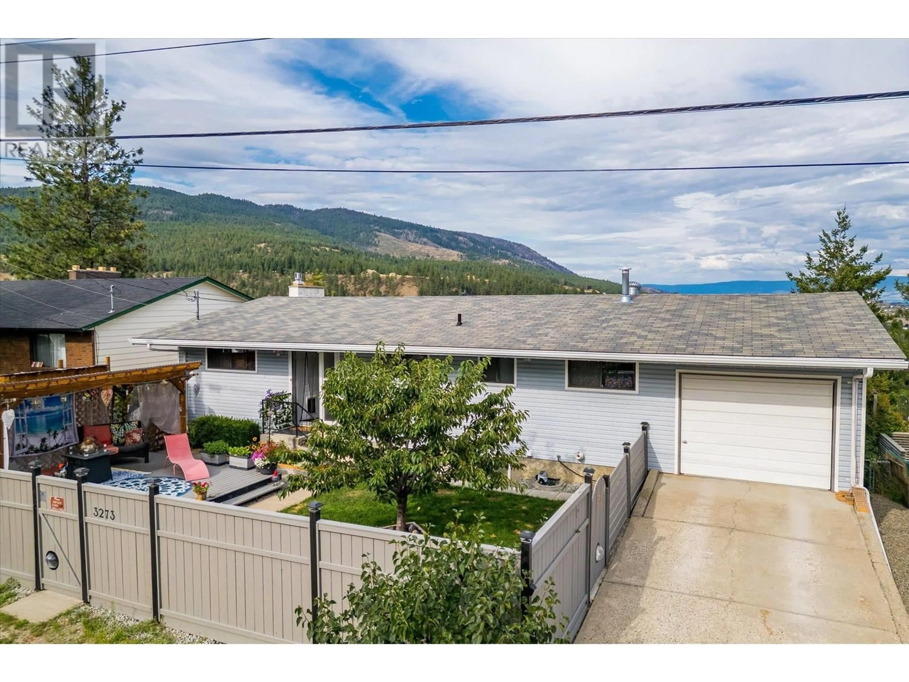 A pic from outside/outdoor area/front of a property/back of a property/a pic from drone, mountain view for 3273 MCLEOD ROAD, West Kelowna British Columbia V4T1A9