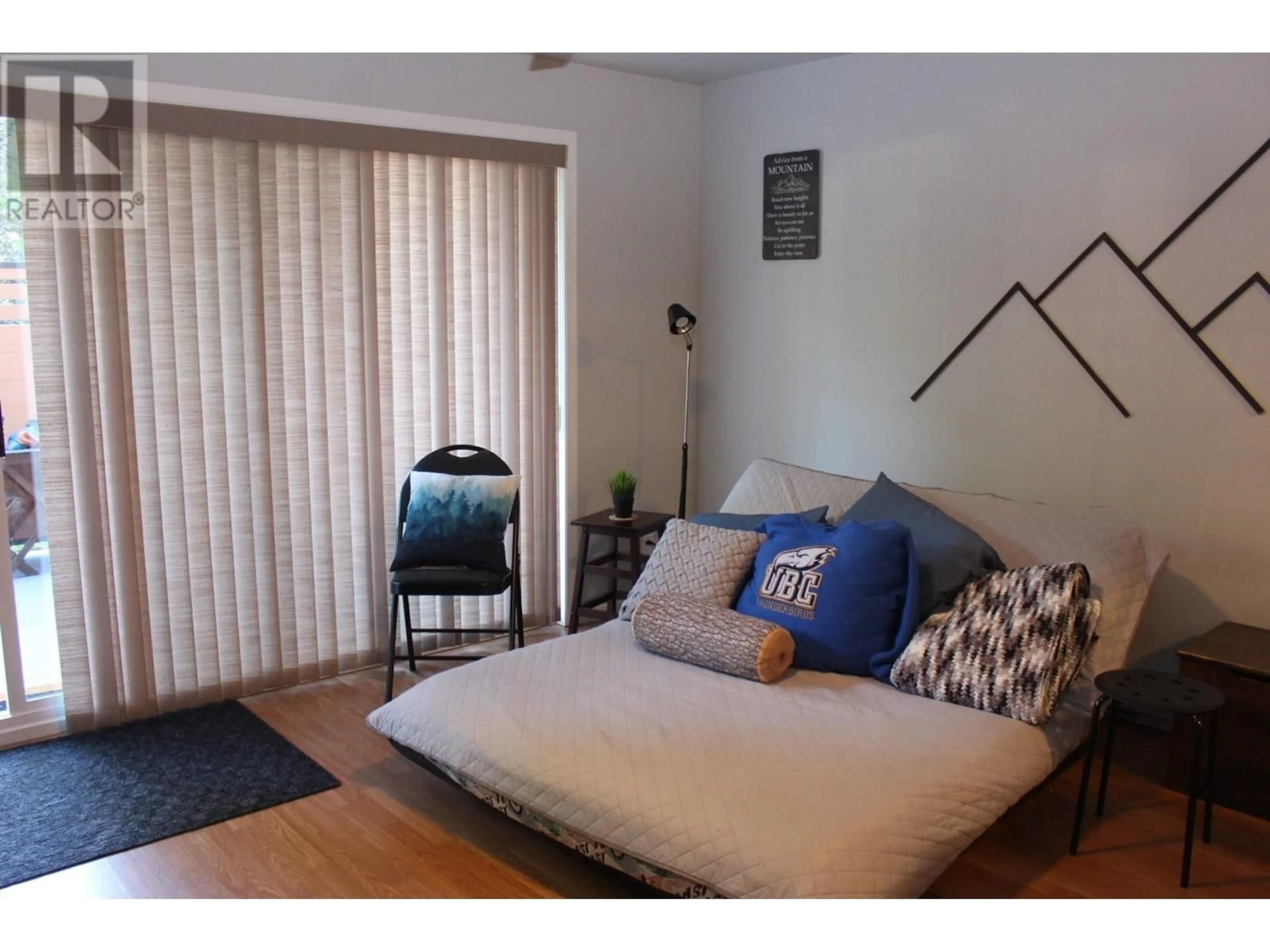 Living room with furniture, wood/laminate floor for 1 - 573 10TH AVENUE, Castlegar British Columbia V1N1K6