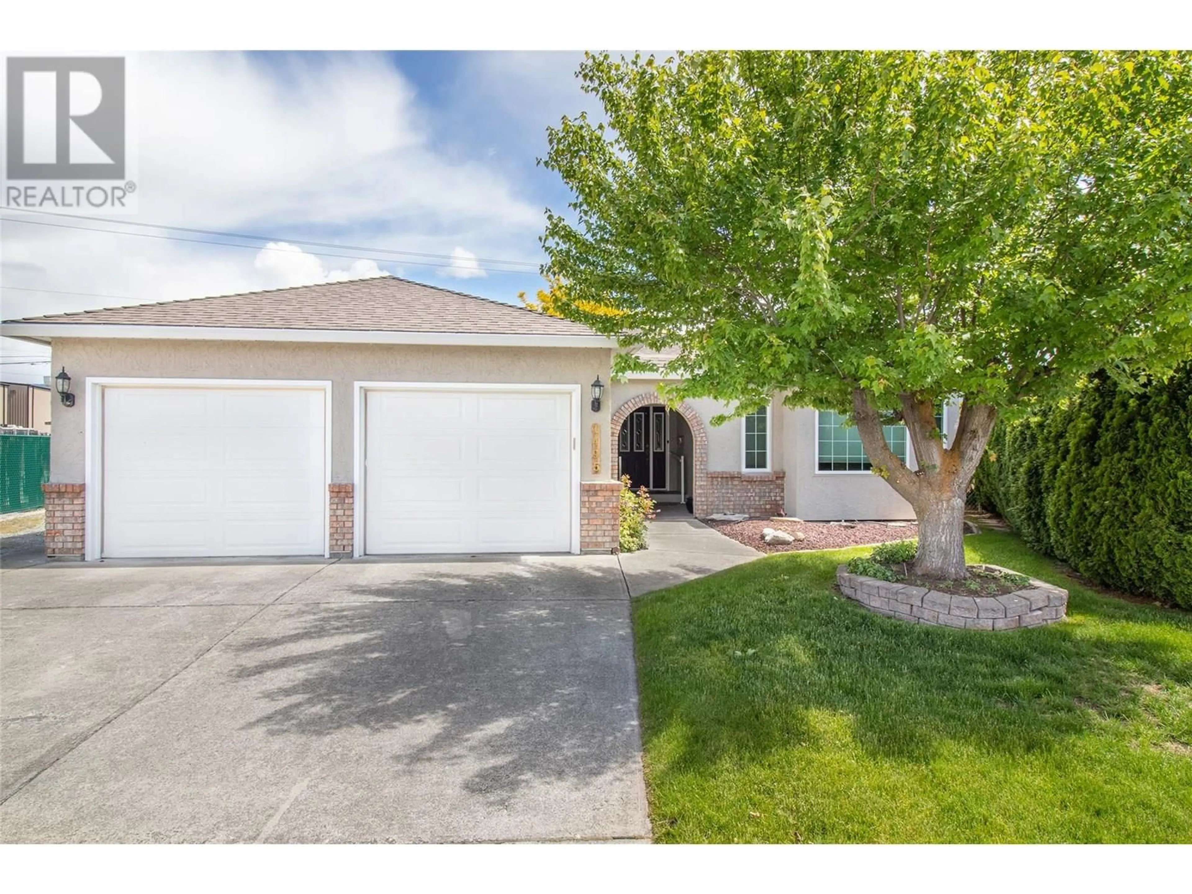 Home with vinyl exterior material, street for 1495 NELSON PLACE, Kelowna British Columbia V1Y9H5