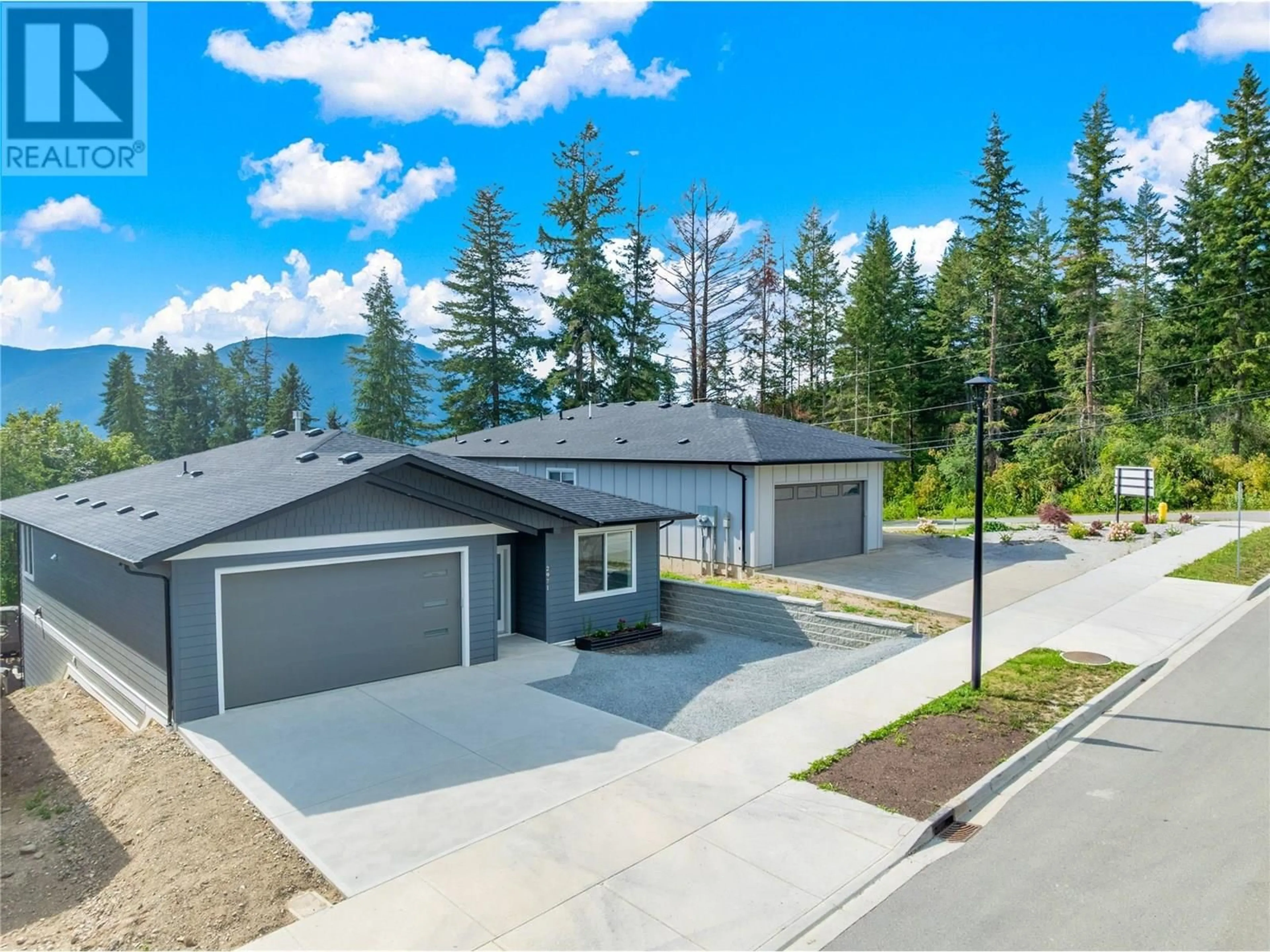 A pic from outside/outdoor area/front of a property/back of a property/a pic from drone, mountain view for 2971 27 STREET NORTHEAST, Salmon Arm British Columbia V1E2Z7