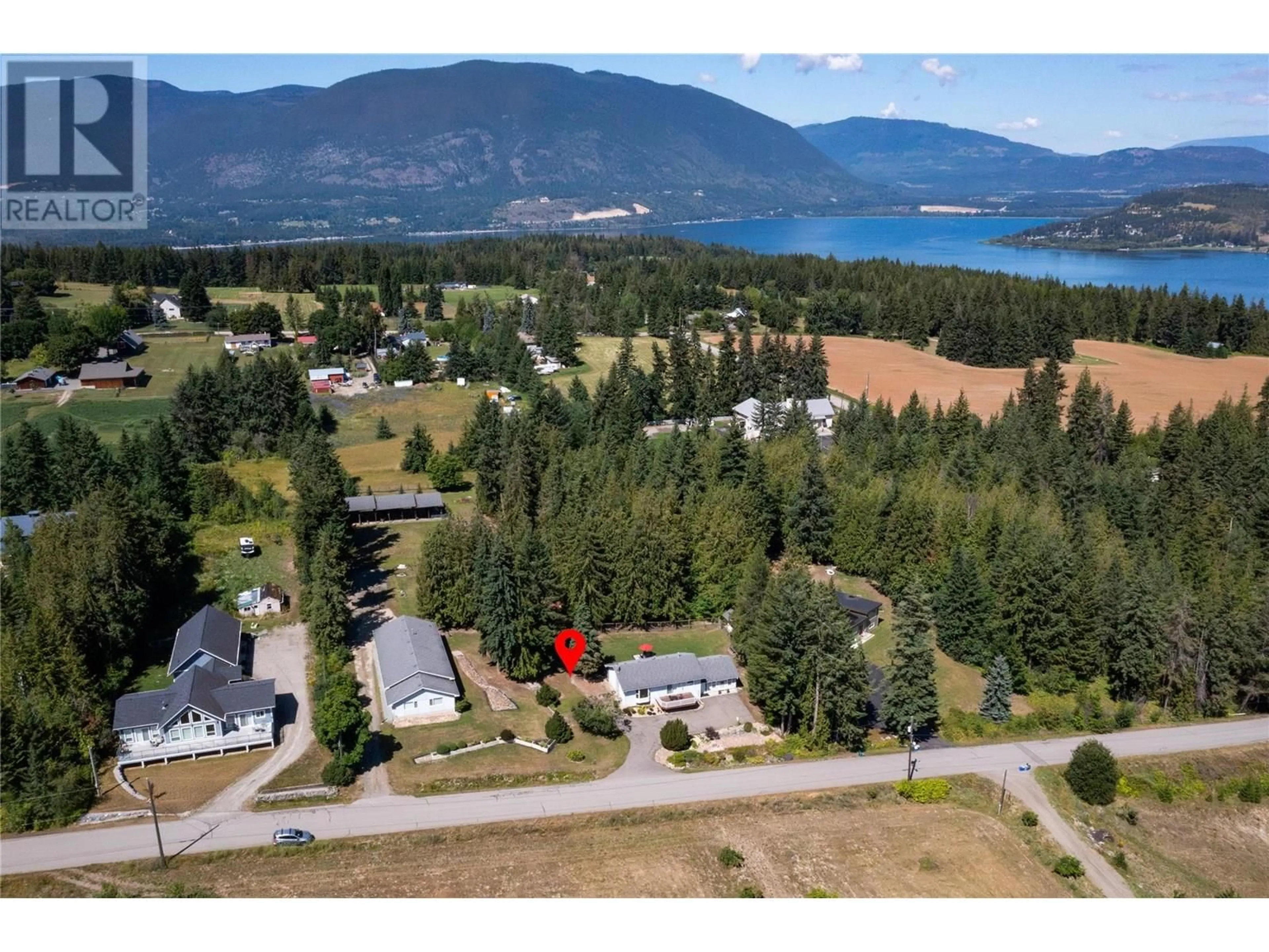 A pic from outside/outdoor area/front of a property/back of a property/a pic from drone, water/lake/river/ocean view for 5801 35 STREET NORTHEAST, Salmon Arm British Columbia V1E2B3