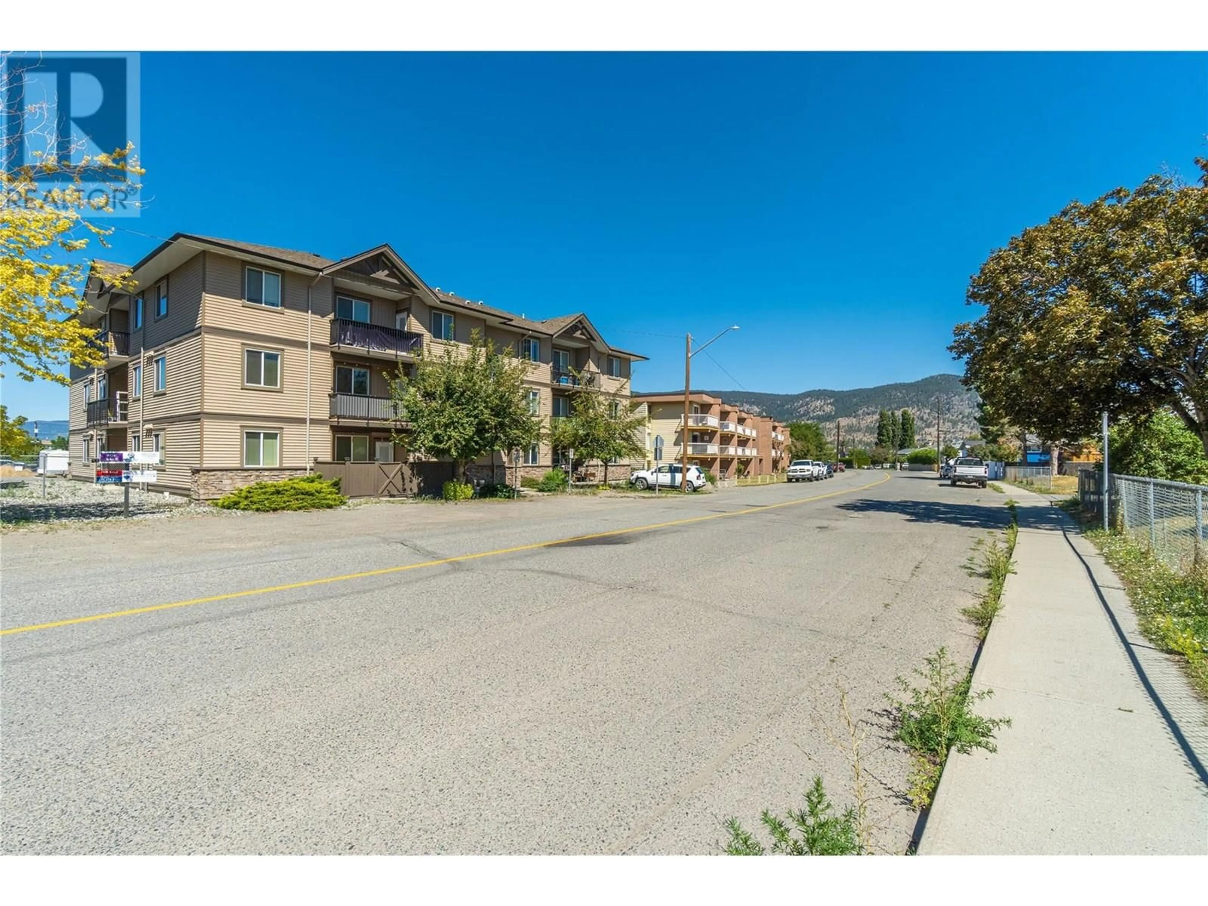 A pic from outside/outdoor area/front of a property/back of a property/a pic from drone, street for 304 - 1701 MENZIES STREET, Merritt British Columbia V1K1A5