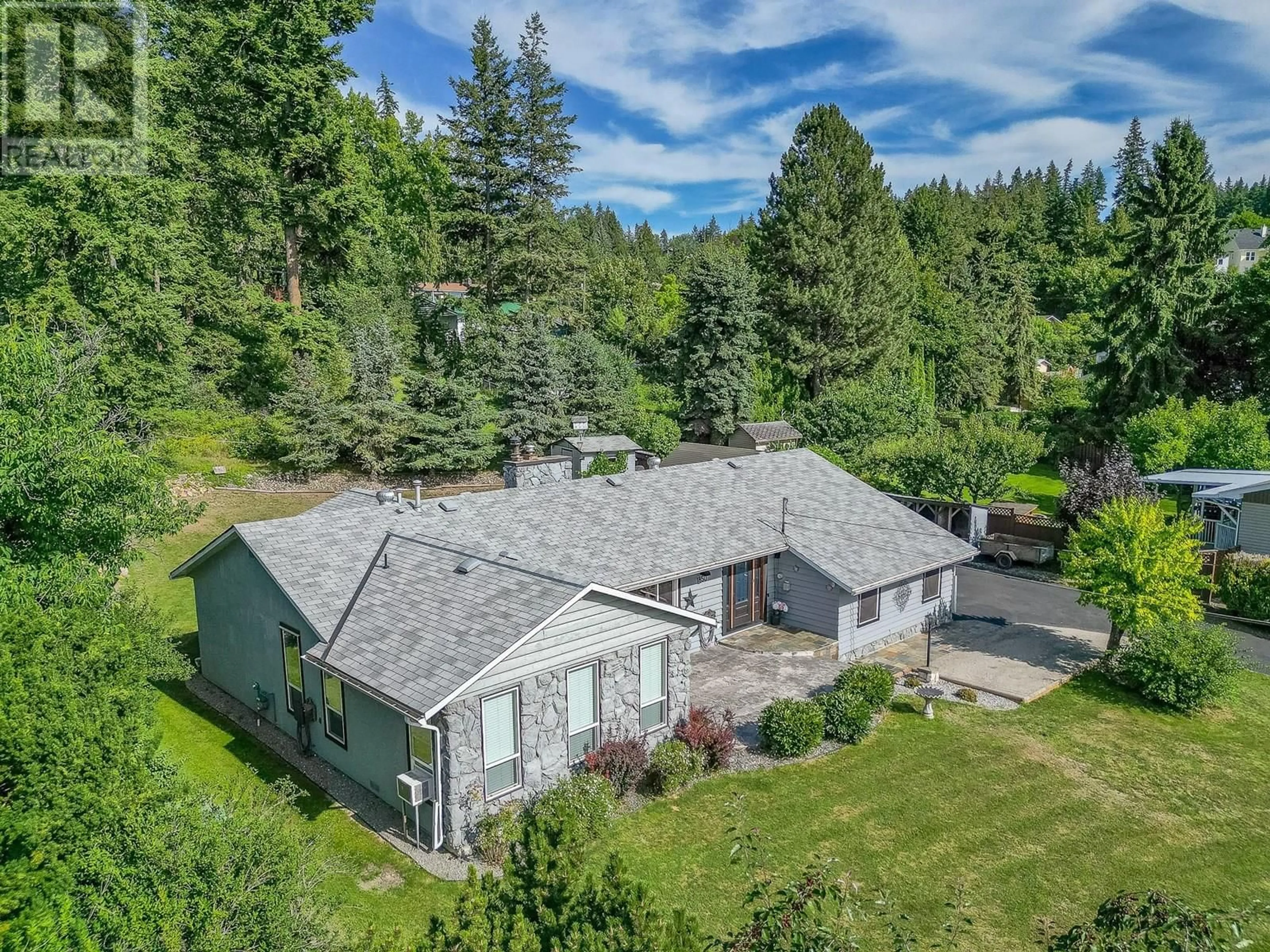 A pic from outside/outdoor area/front of a property/back of a property/a pic from drone, mountain view for 1850 LAKESHORE ROAD, Salmon Arm British Columbia V1E3X7