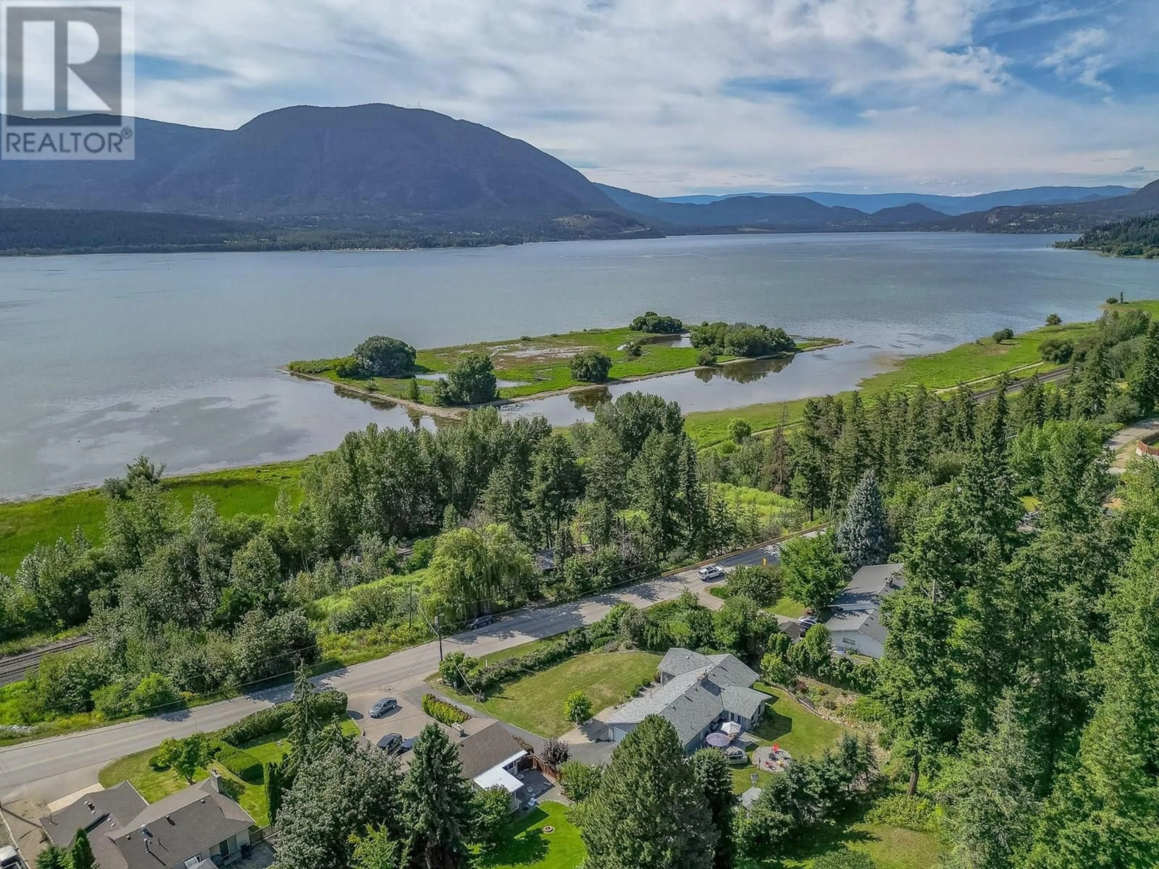 A pic from outside/outdoor area/front of a property/back of a property/a pic from drone, water/lake/river/ocean view for 1850 LAKESHORE ROAD, Salmon Arm British Columbia V1E3X7