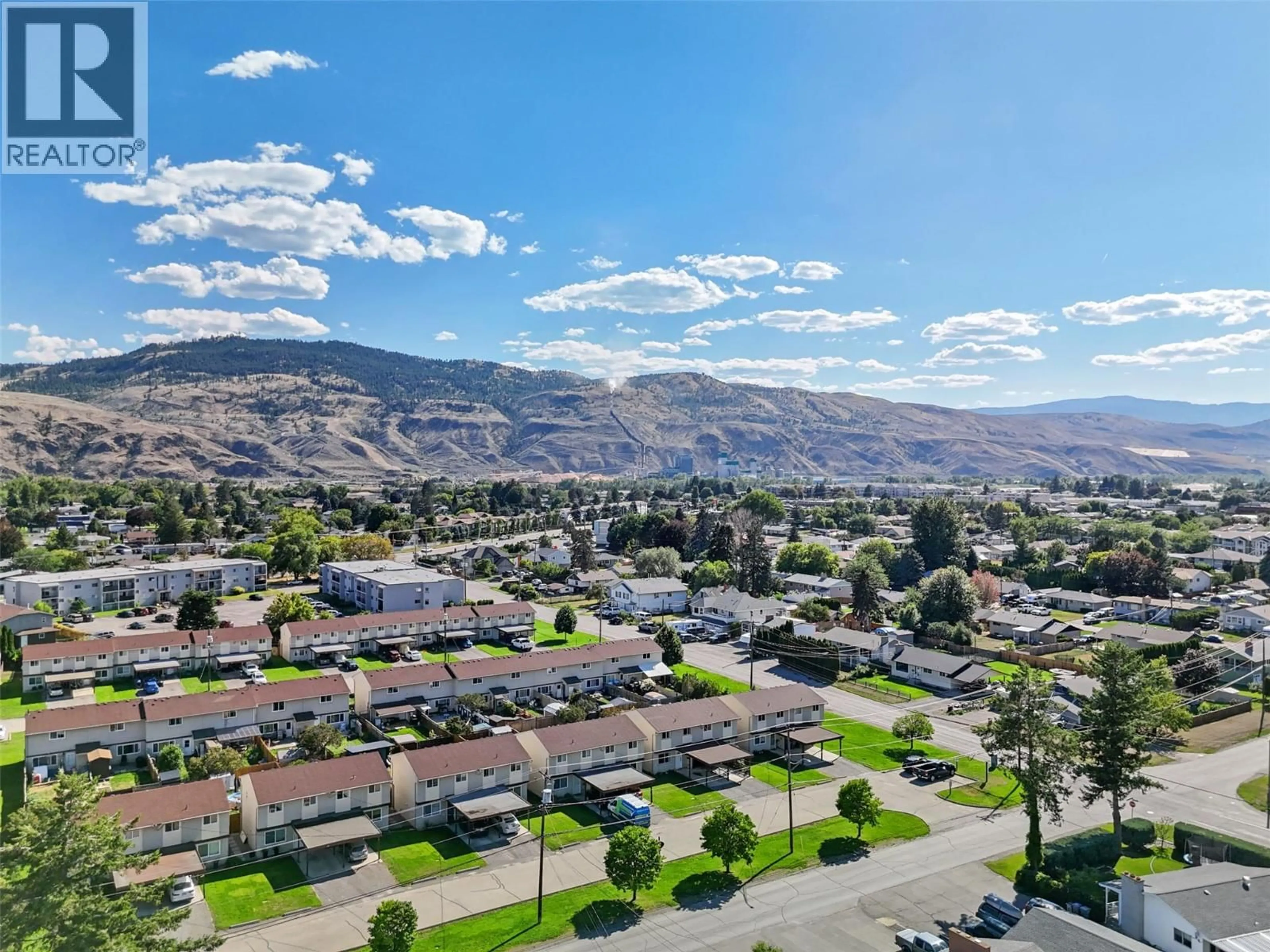 A pic from outside/outdoor area/front of a property/back of a property/a pic from drone, mountain view for 4 - 1697 GREENFIELD AVENUE, Kamloops British Columbia V2B4N5