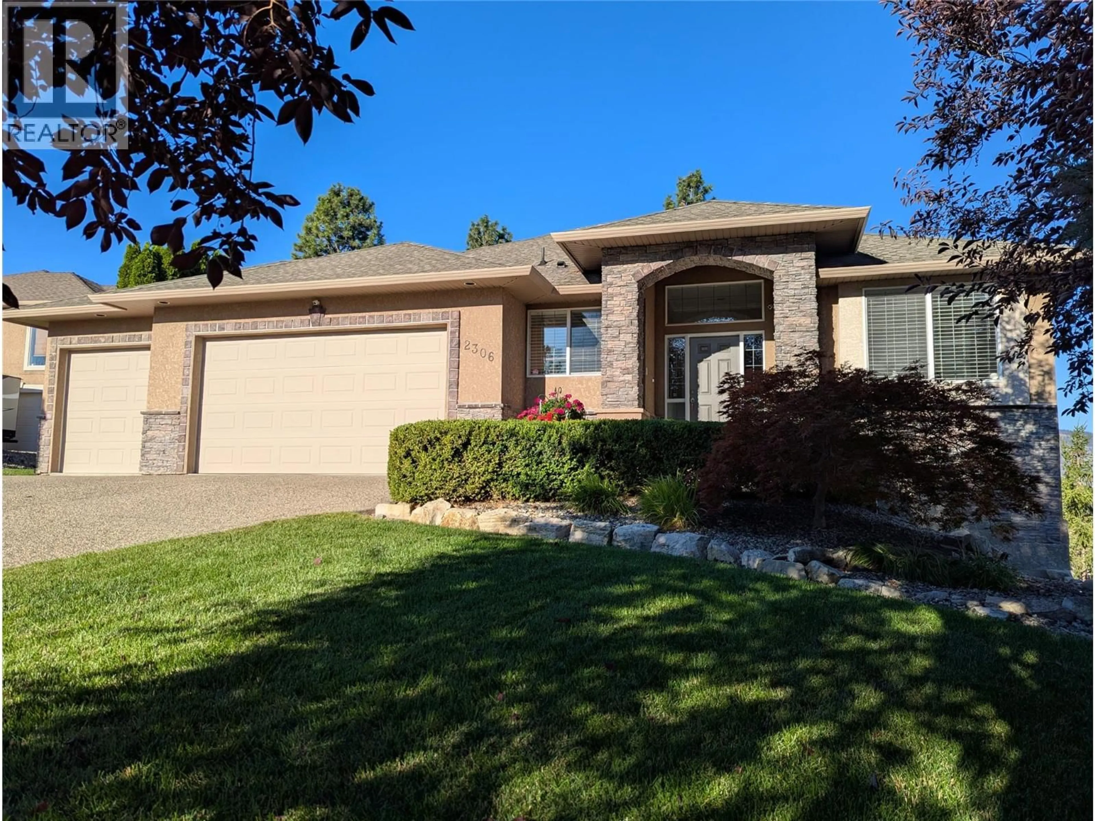 Home with brick exterior material, street for 2306 QUAIL RUN DRIVE, Kelowna British Columbia V1V2S3