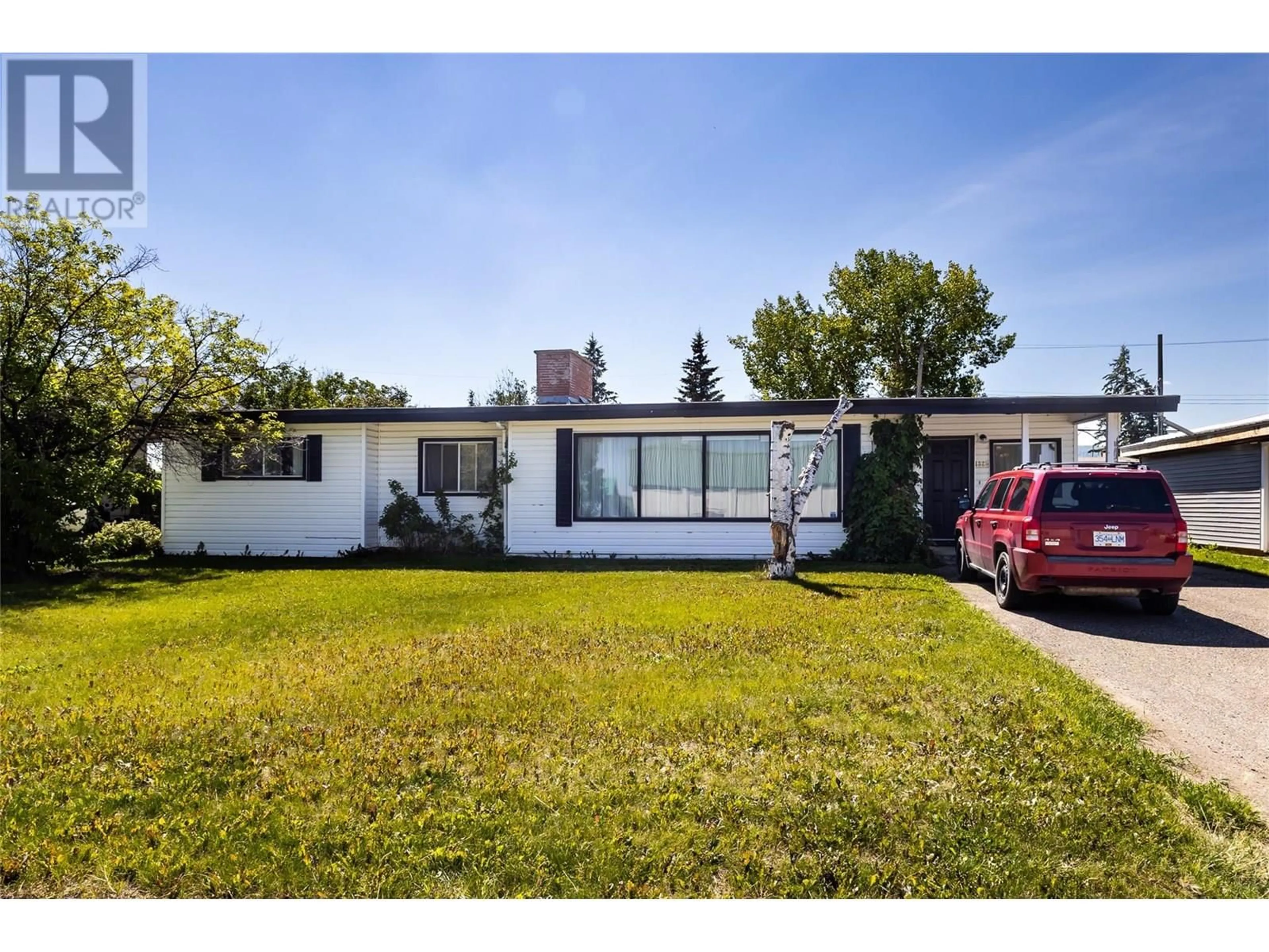 Home with vinyl exterior material, street for 1325 115 AVENUE, Dawson Creek British Columbia V1G3C3