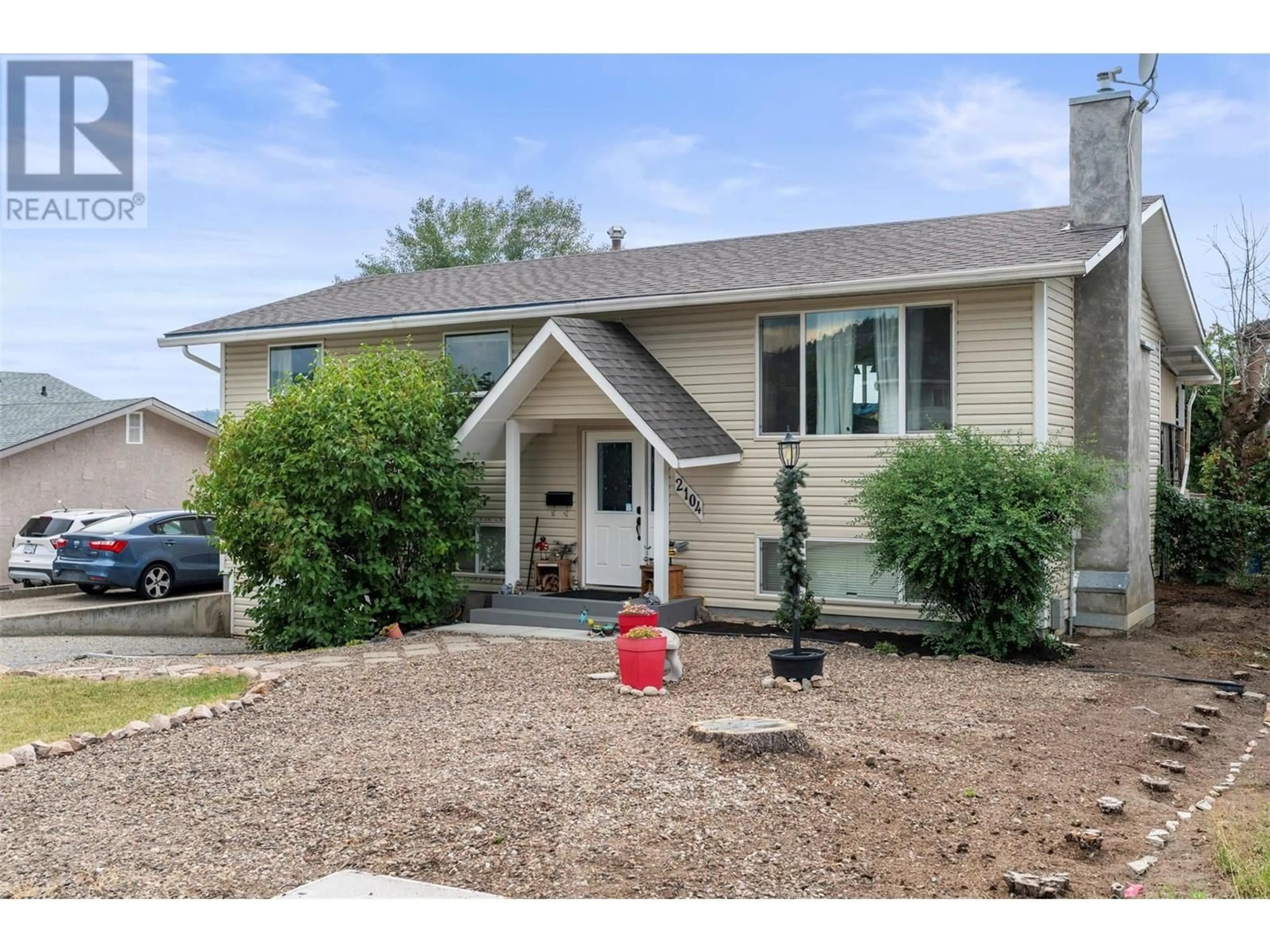 Home with vinyl exterior material, street for 2104 11 STREET, Vernon British Columbia V1T3S2