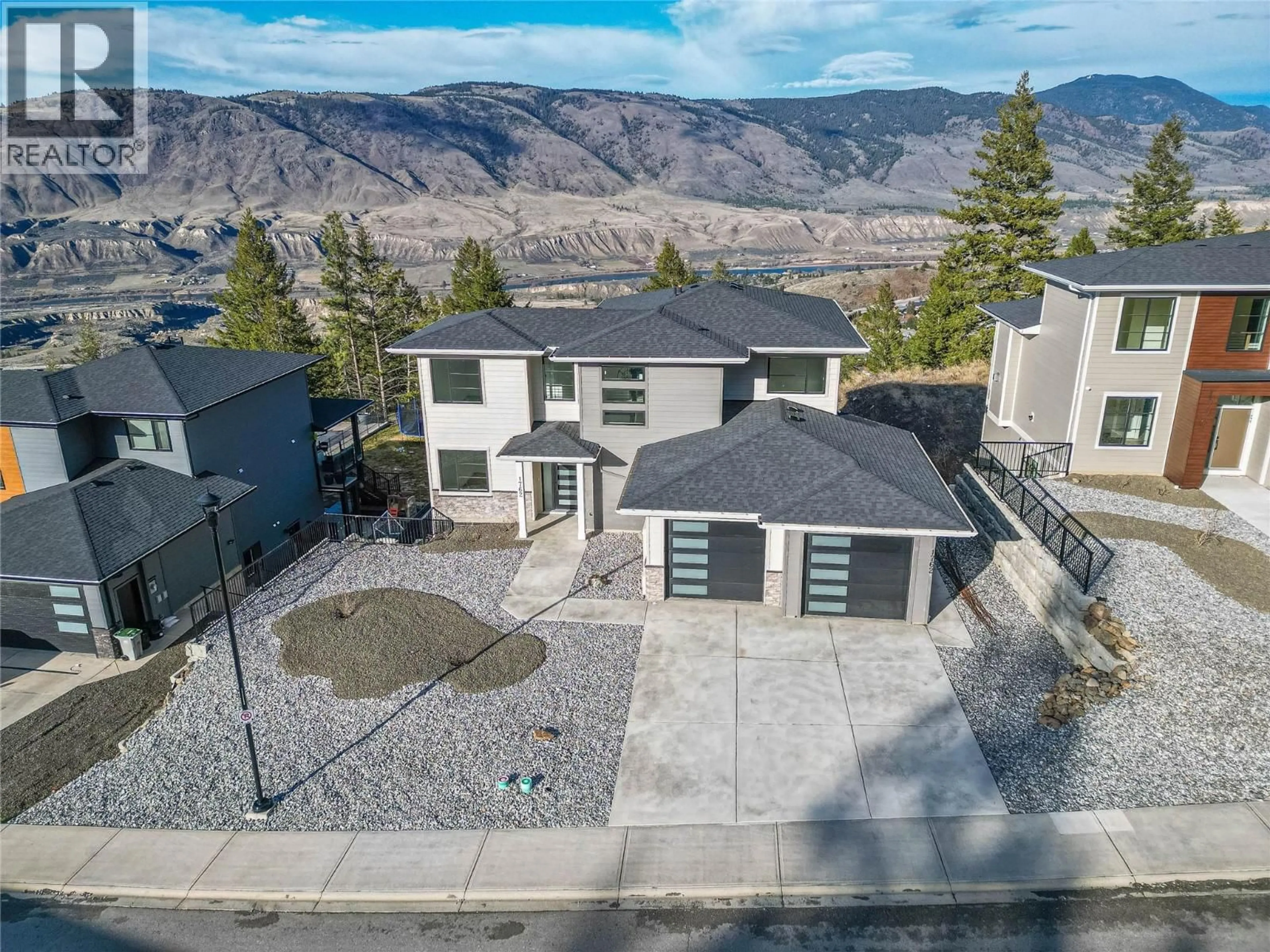 A pic from outside/outdoor area/front of a property/back of a property/a pic from drone, mountain view for 1762 BALSAM PLACE, Kamloops British Columbia V2E0E2