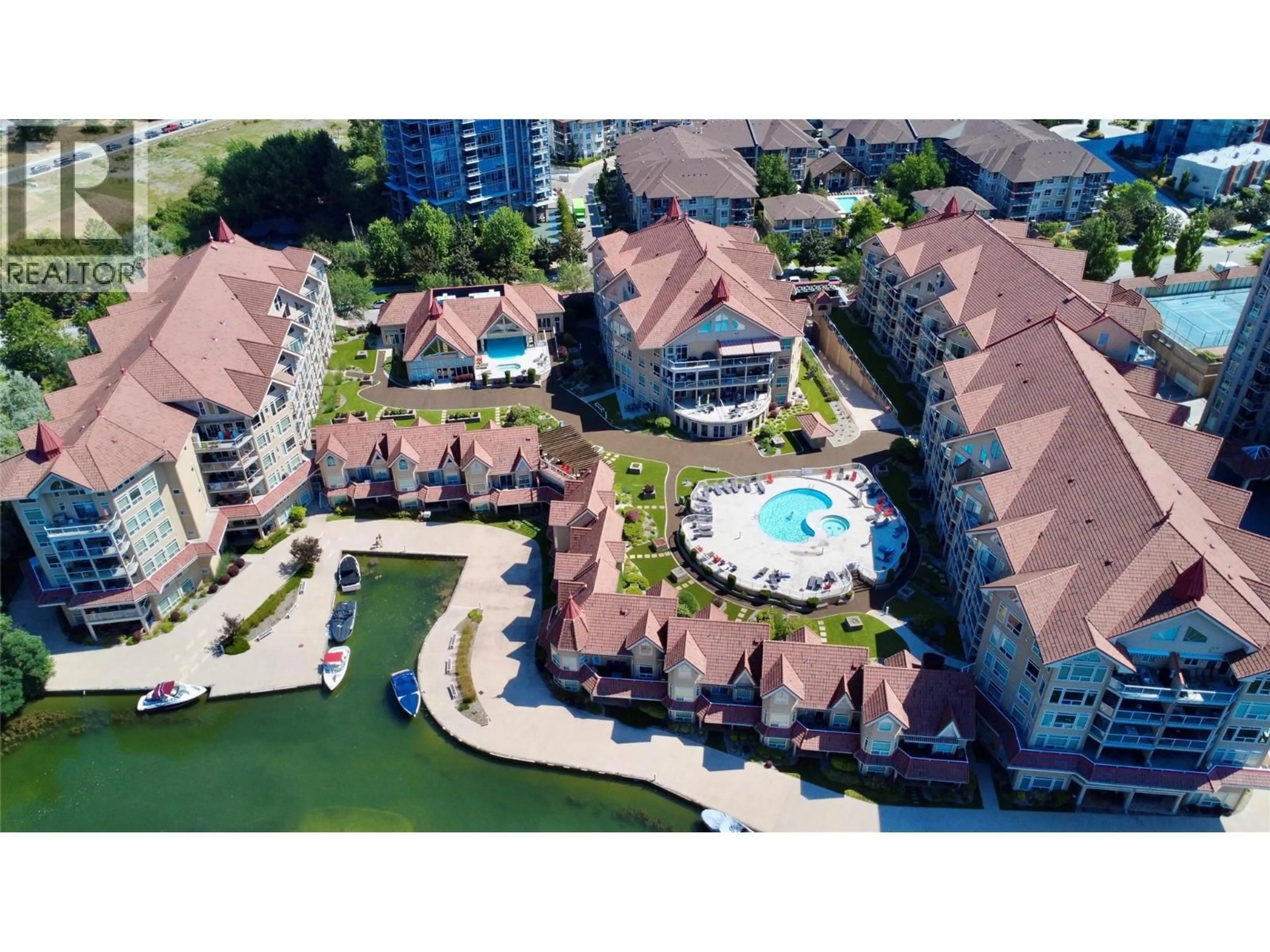 A pic from outside/outdoor area/front of a property/back of a property/a pic from drone, water/lake/river/ocean view for 410 - 1088 SUNSET DRIVE, Kelowna British Columbia V1Y9W1