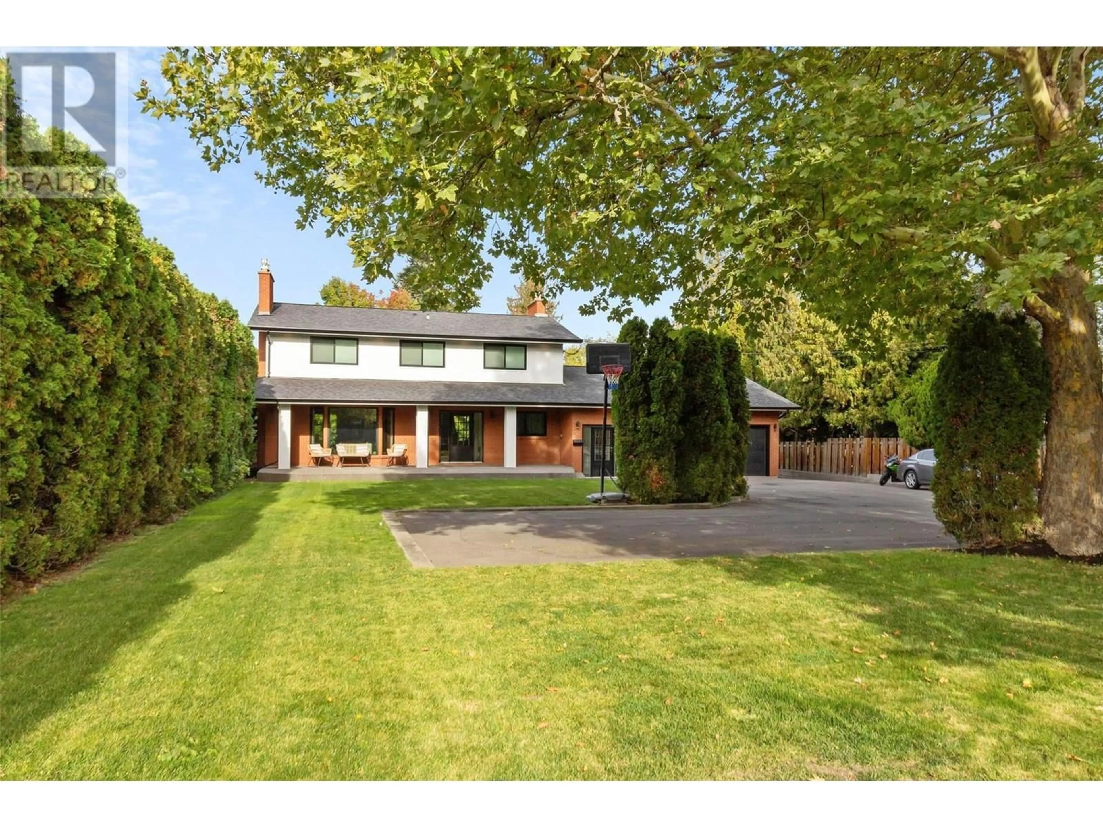 A pic from outside/outdoor area/front of a property/back of a property/a pic from drone, street for 4540 LAKESHORE ROAD, Kelowna British Columbia V1W1X2