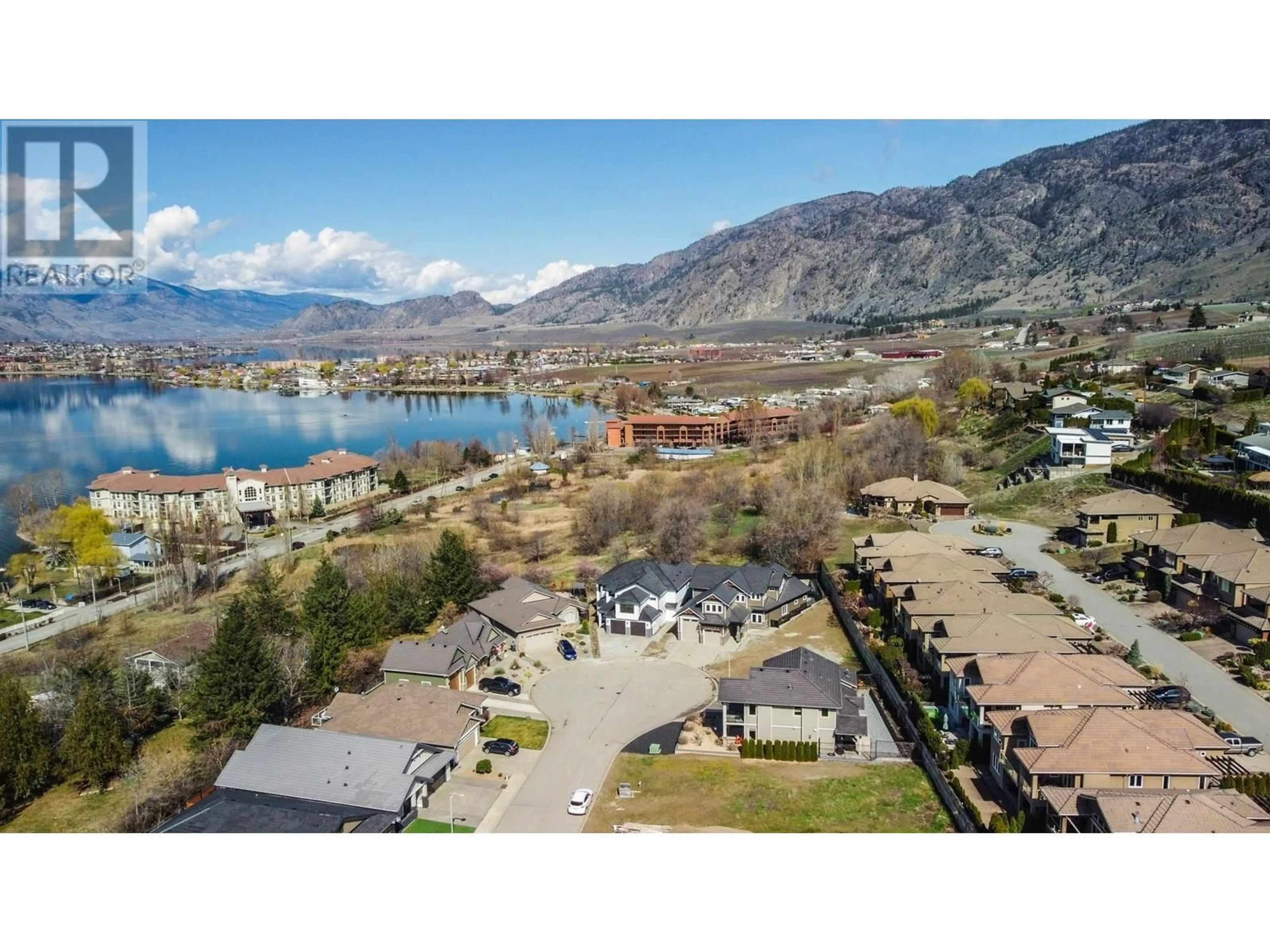 A pic from outside/outdoor area/front of a property/back of a property/a pic from drone, water/lake/river/ocean view for 18 CHARDONNAY COURT, Osoyoos British Columbia V0H1V6