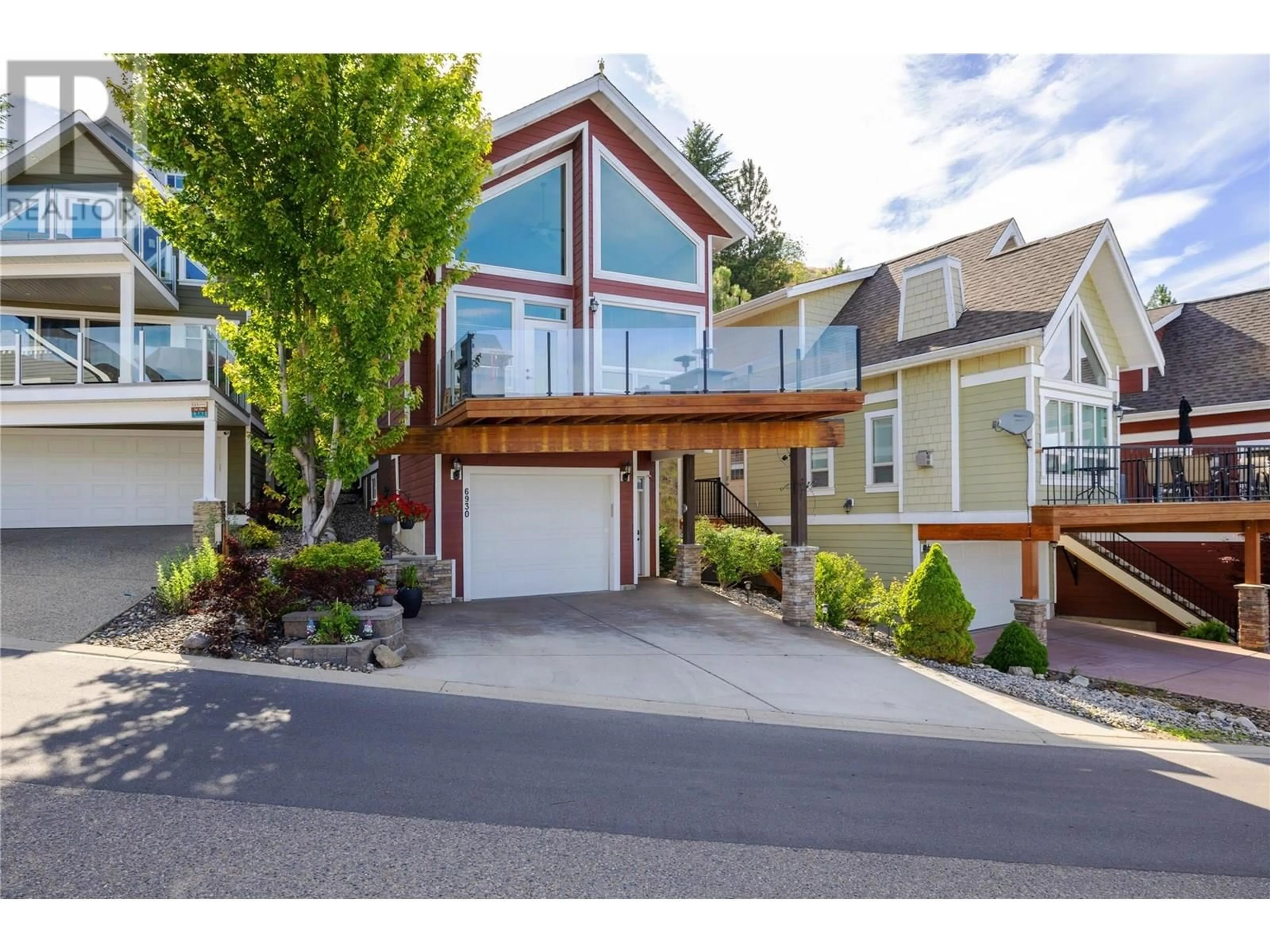 Home with vinyl exterior material, street for 47 - 6930 BARCELONA DRIVE EAST, Fintry British Columbia V1Z3R8