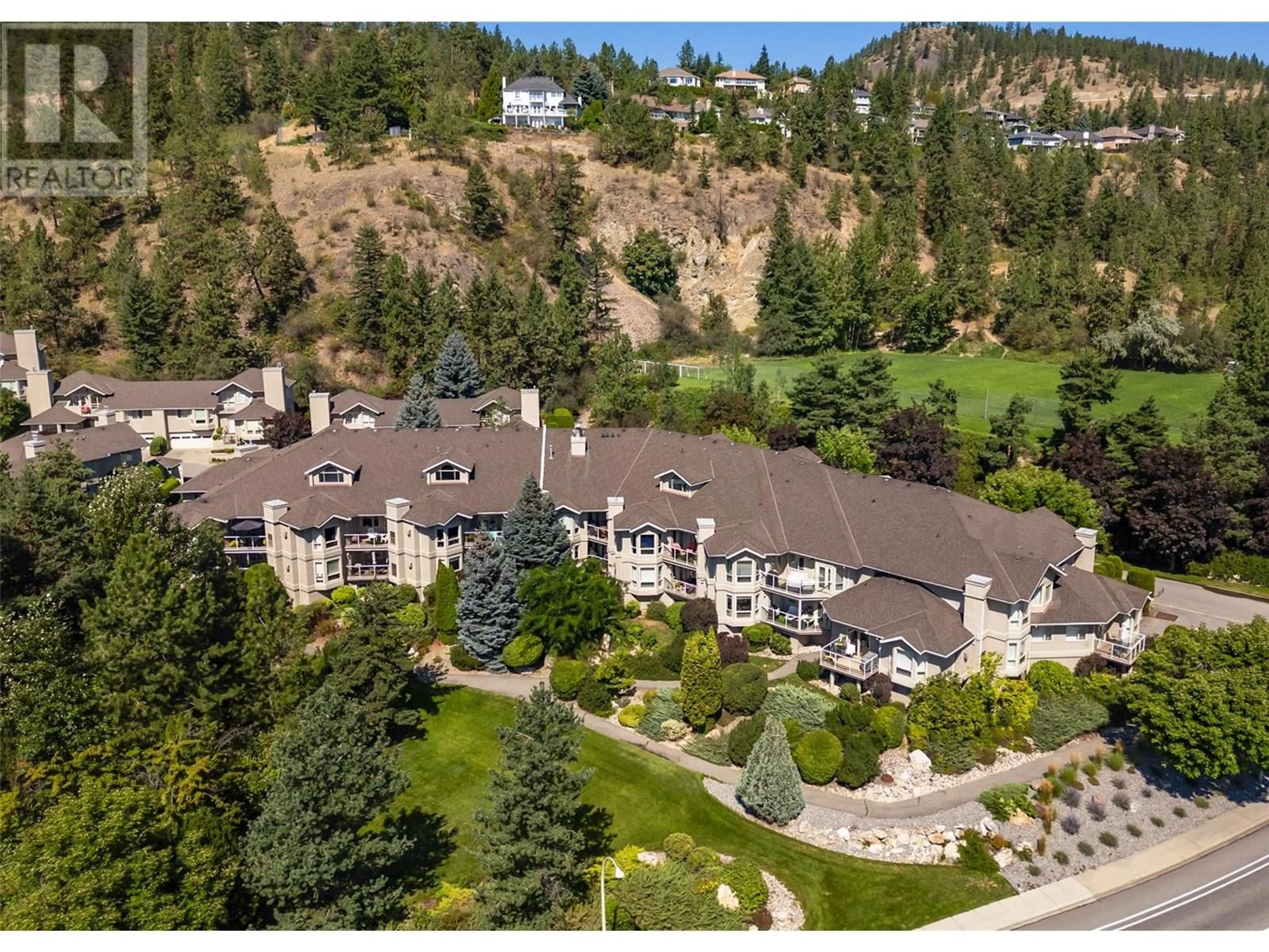 A pic from outside/outdoor area/front of a property/back of a property/a pic from drone, mountain view for 111 - 980 DILWORTH DRIVE, Kelowna British Columbia V1V1S6