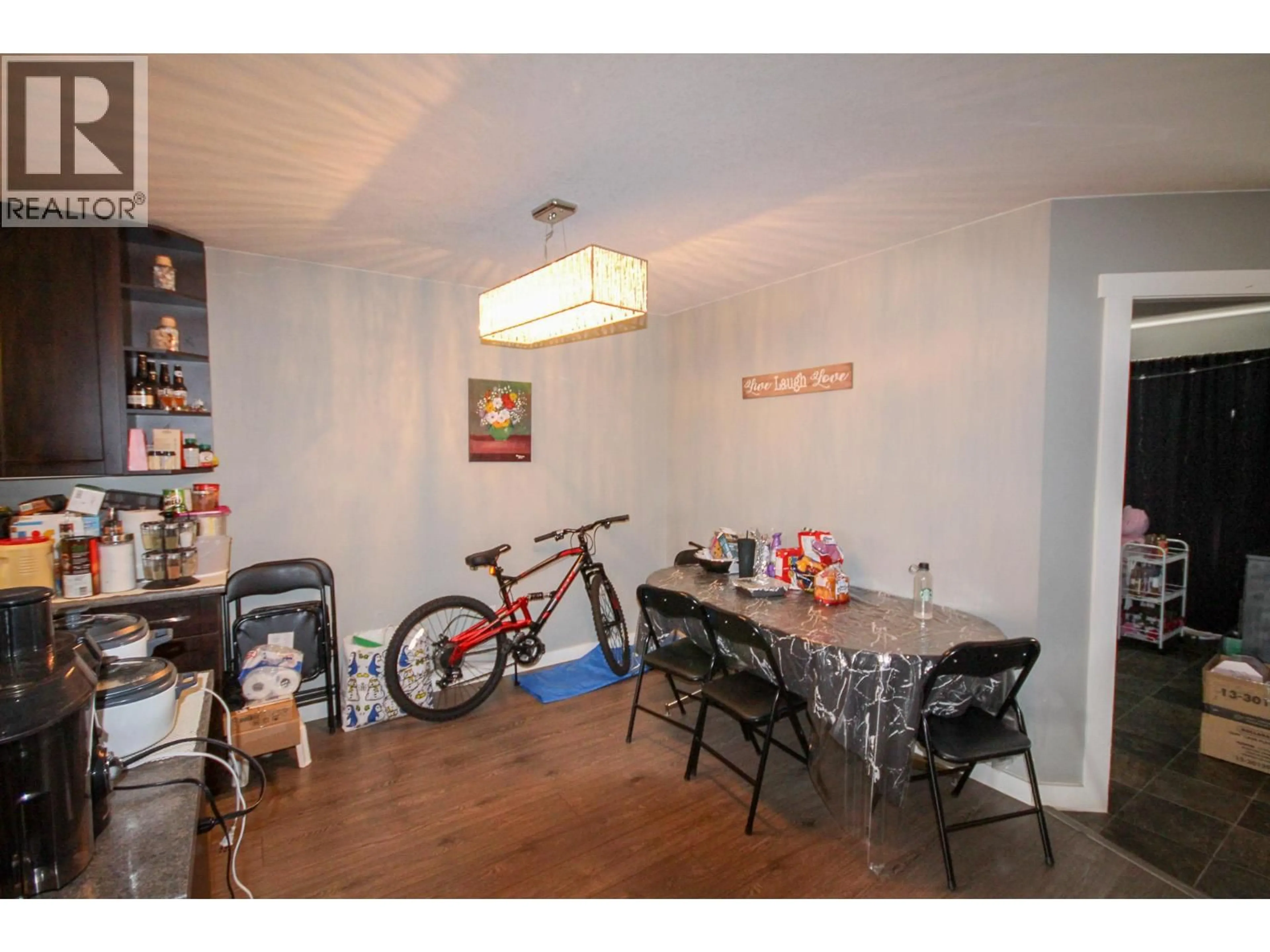 Dining room, wood/laminate floor for 8219 18 STREET, Dawson Creek British Columbia V1G0G4