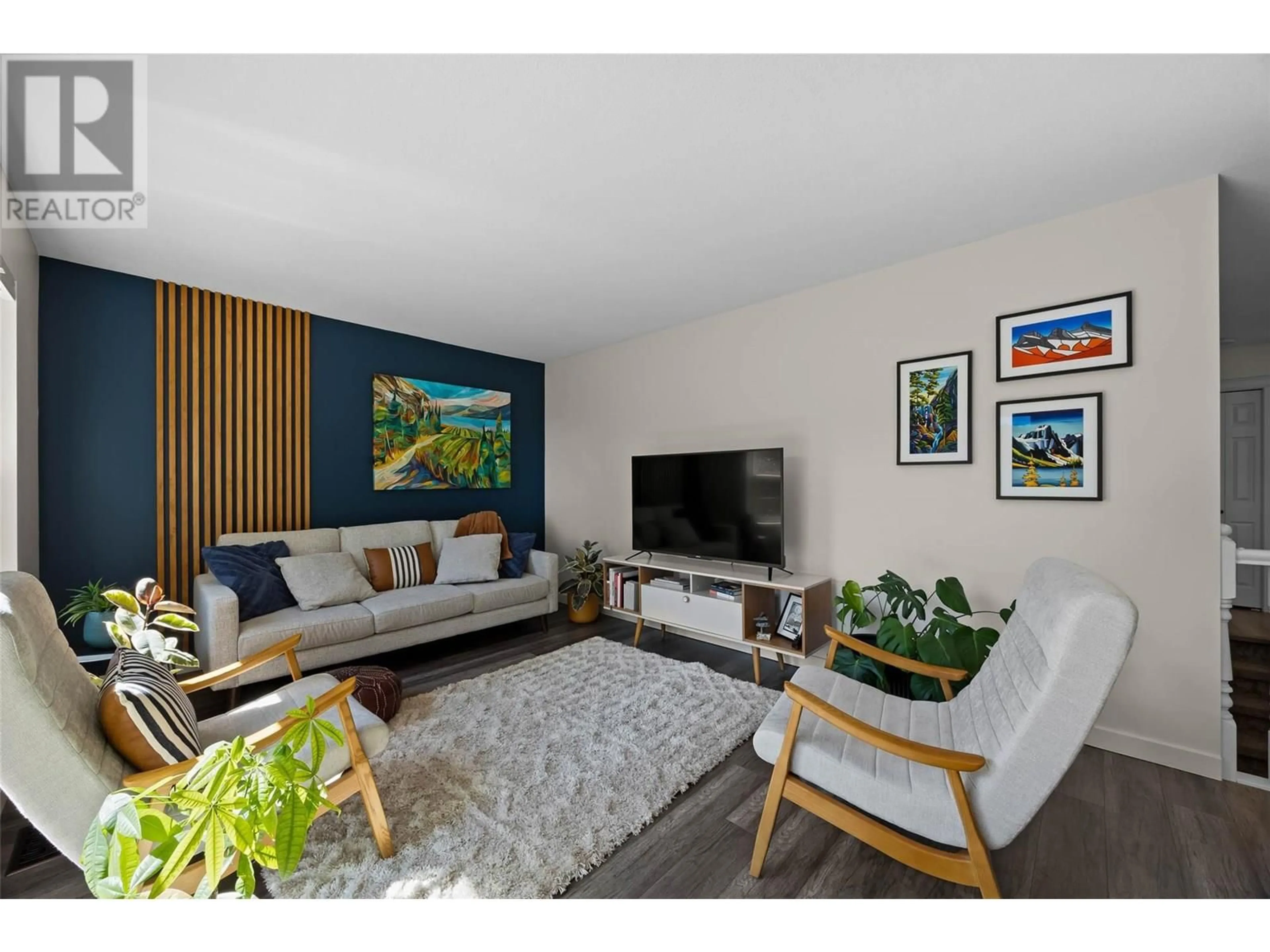 Living room with furniture, wood/laminate floor for 2293 TURNBERRY PLACE, Kamloops British Columbia V1S1S9