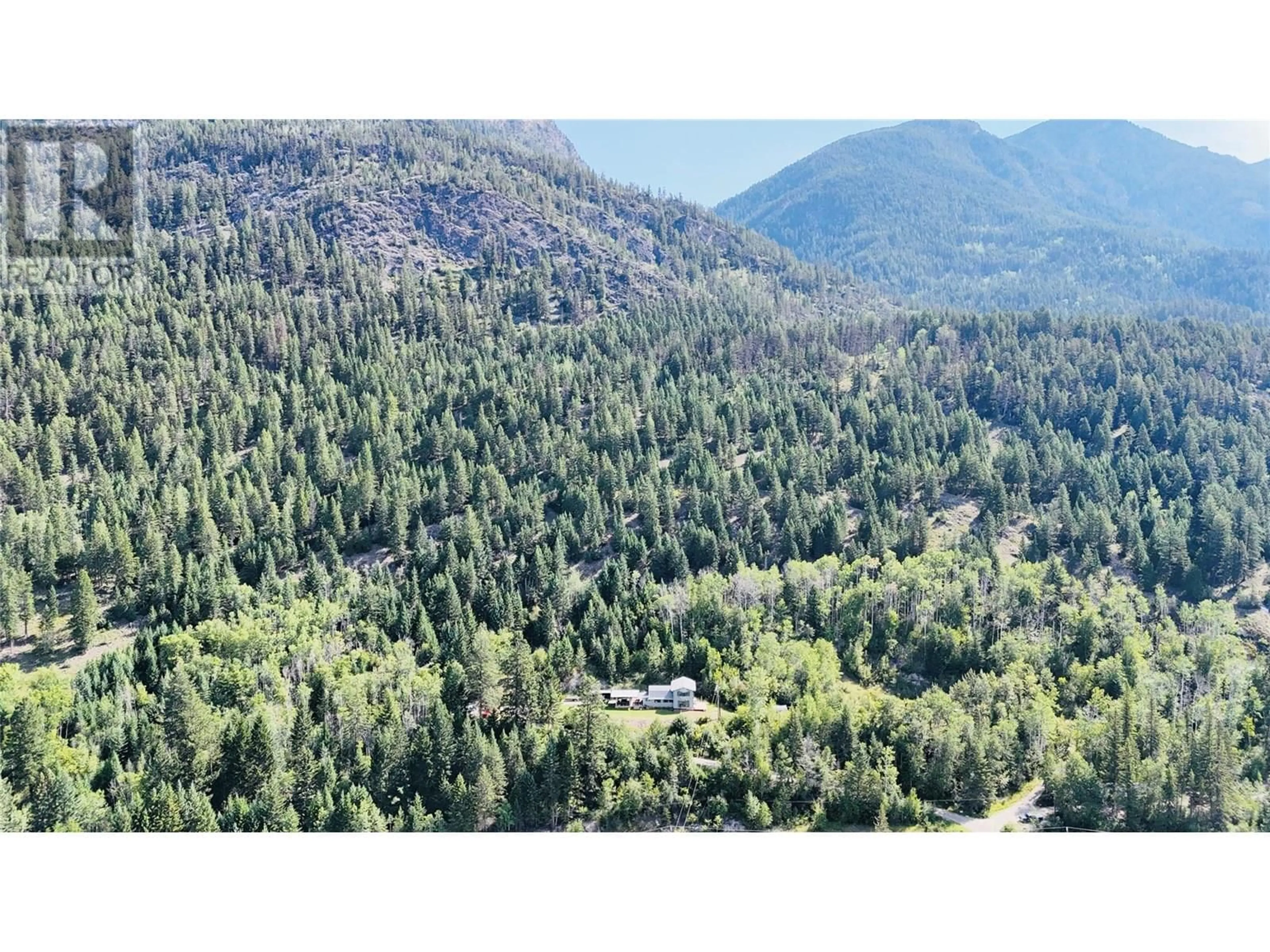 A pic from outside/outdoor area/front of a property/back of a property/a pic from drone, forest/trees view for 2538 95 HIGHWAY, Brisco British Columbia V0A1B0