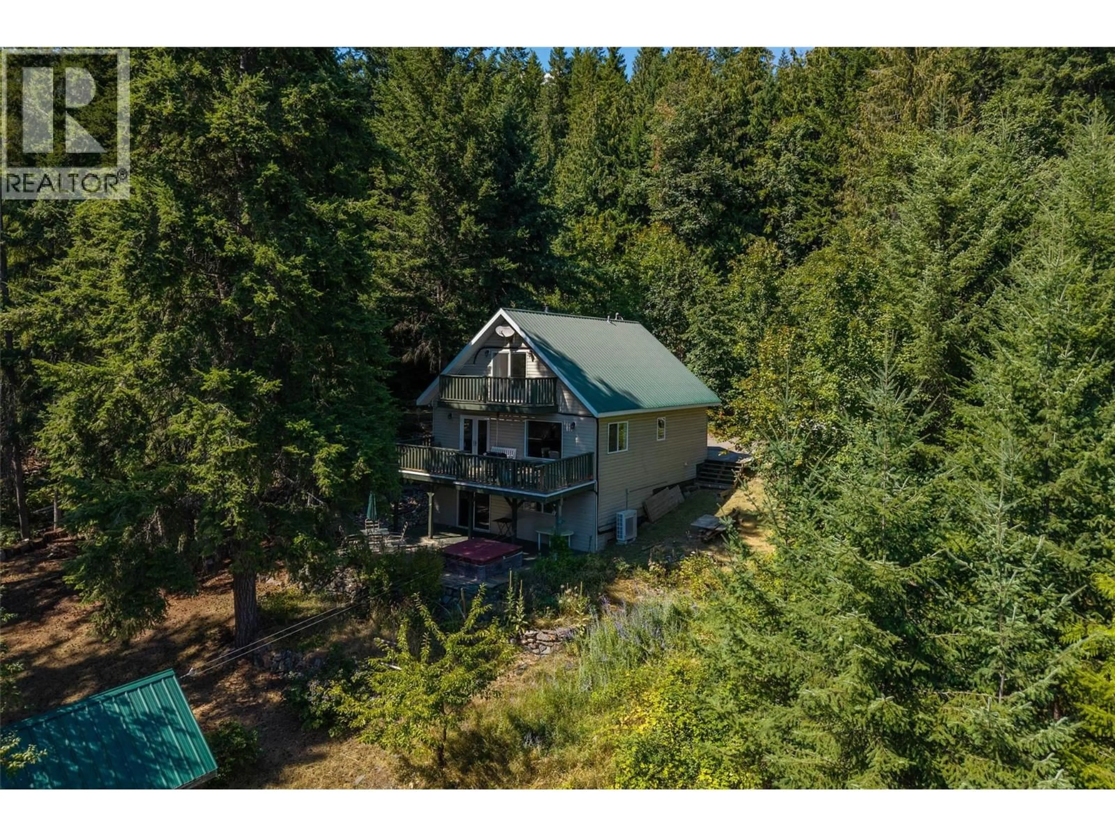 A pic from outside/outdoor area/front of a property/back of a property/a pic from drone, forest/trees view for 7610 ORCHARD GROVE, Anglemont British Columbia V0E1M8