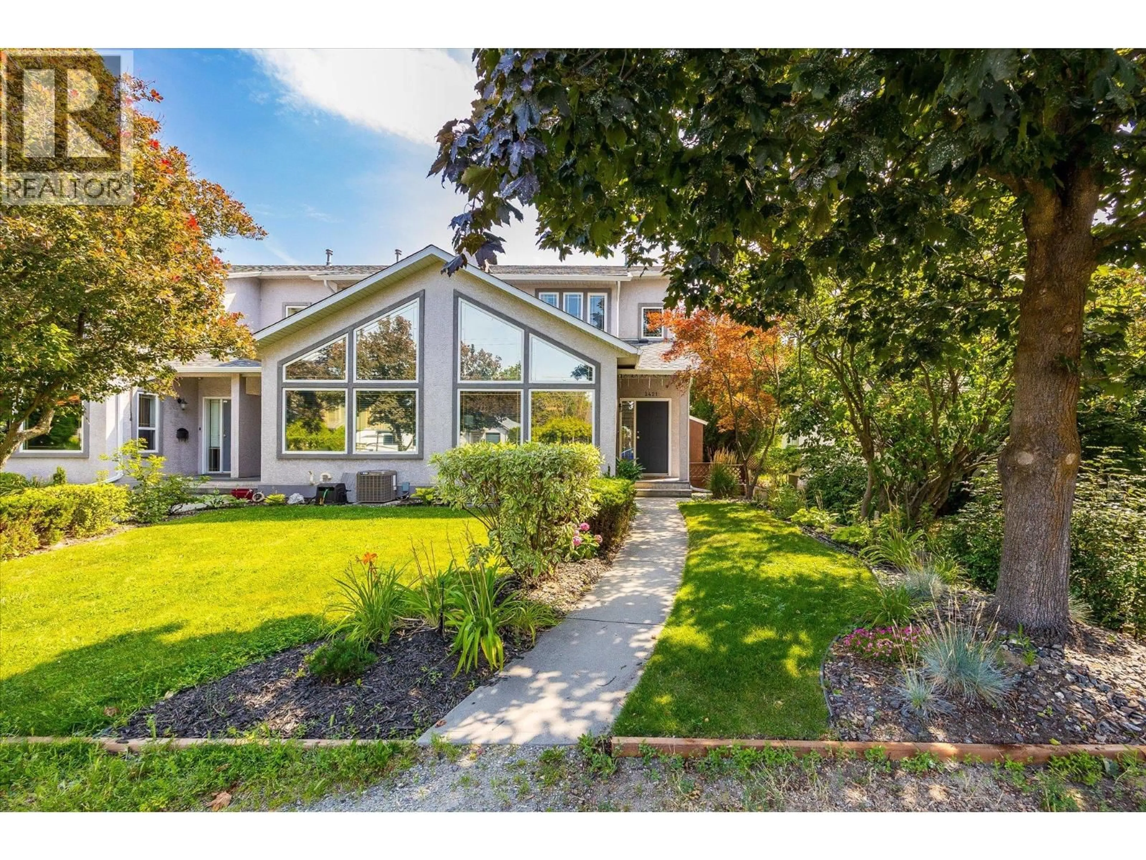 Home with vinyl exterior material, street for 2421 RICHTER STREET, Kelowna British Columbia V1Y2P5