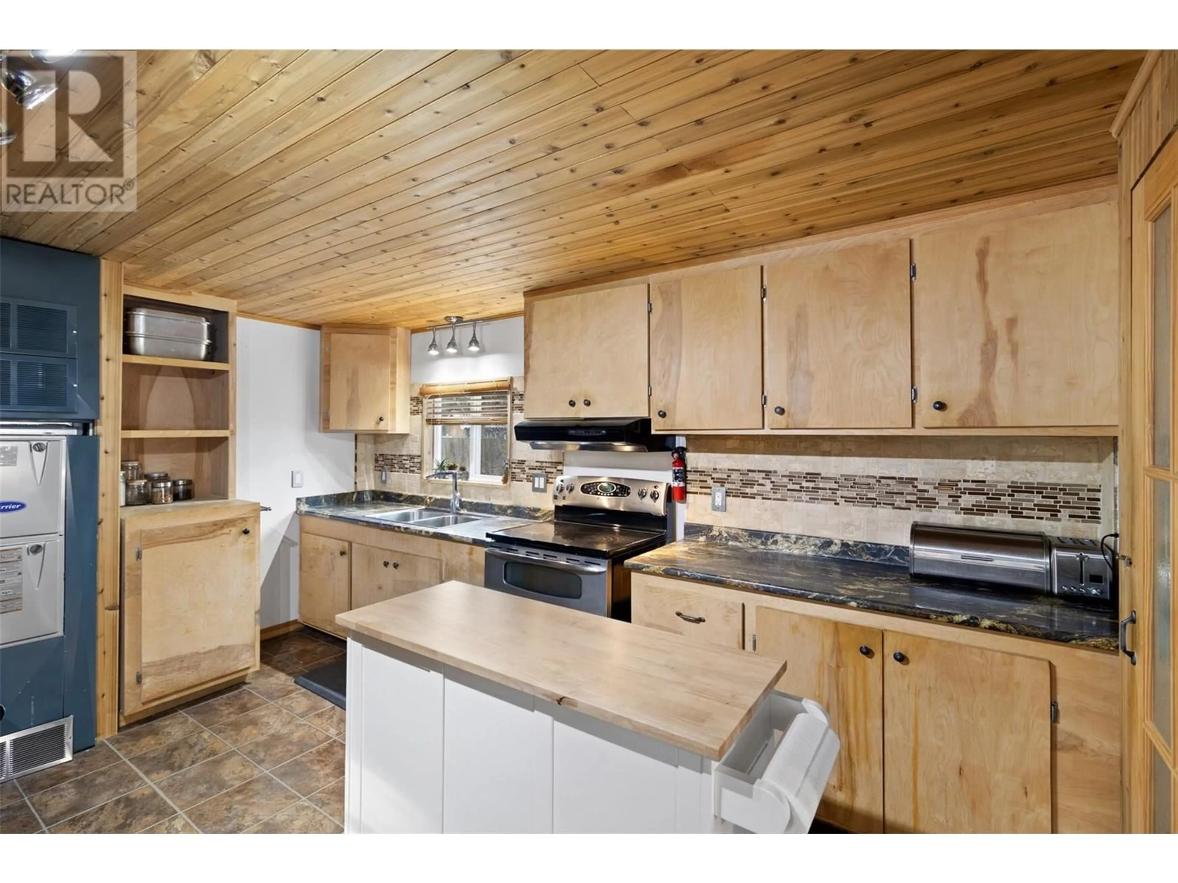 Open concept kitchen, wood/laminate floor for 105 - 2401 ORD ROAD, Kamloops British Columbia V2B7V8